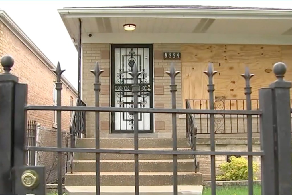 The home sits behind a fence with a lock on the South Side of the city.