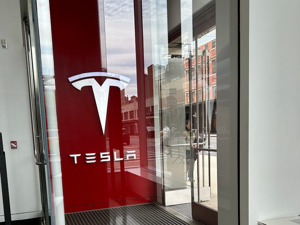 Tesla sign at door