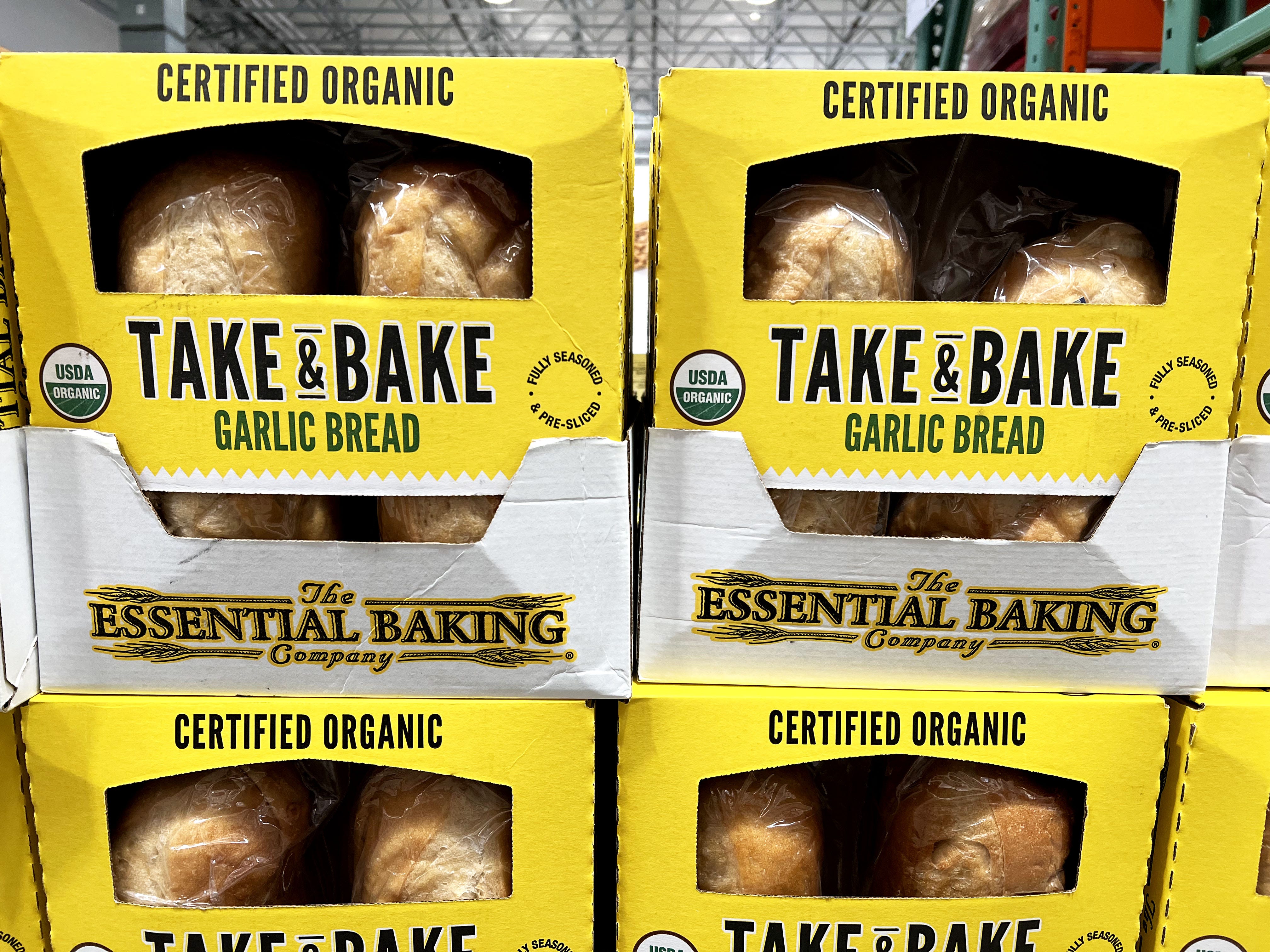 Boxes of The Essential Baking Company's take-and-bake garlic bread at Costco.