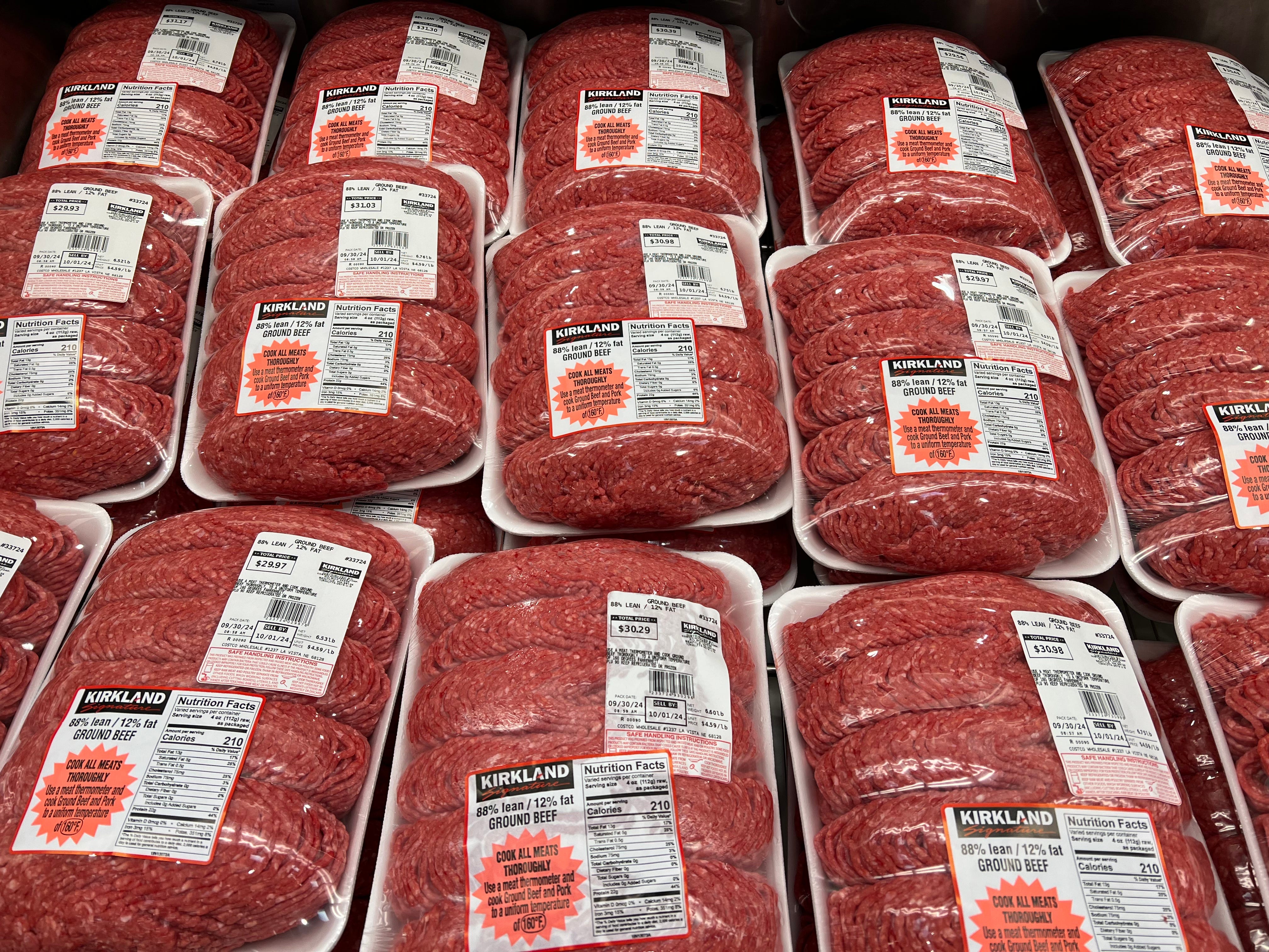 Packages of Kirkland Signature ground beef in the refrigerated section at Costco.