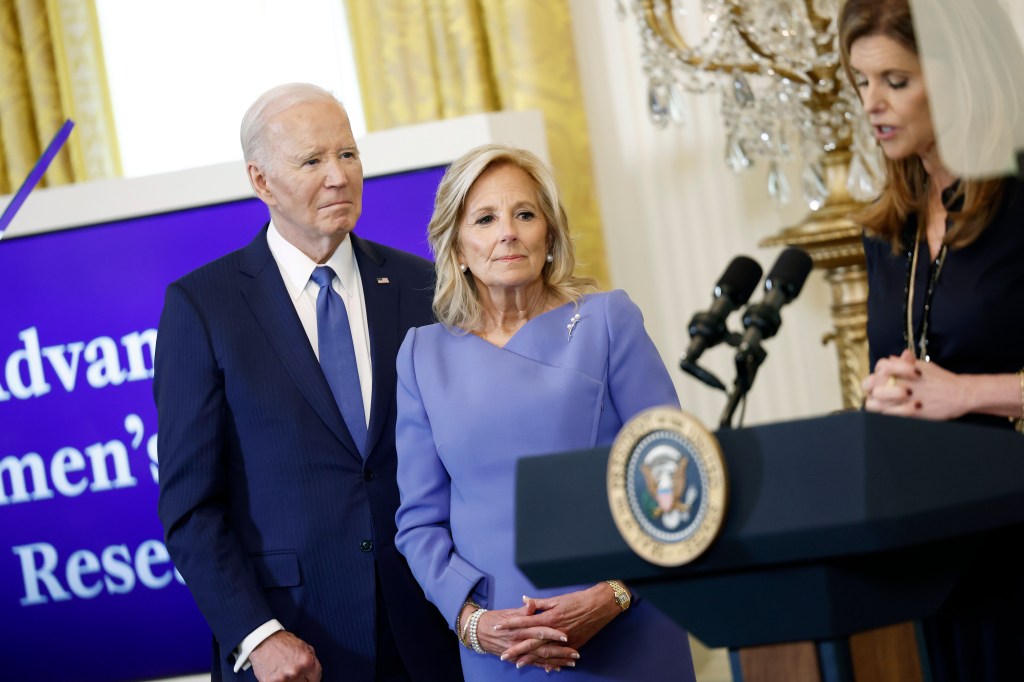 President Joe Biden and first lady Jill Biden listen as Maria Shriver, the former first lady of California, speaks during a Womenâs History Month reception in the East Room of the White House on March 18, 2024 in Washington, DC. The event is a part of the Biden administrationâs Womenâs Health Research initiative. 