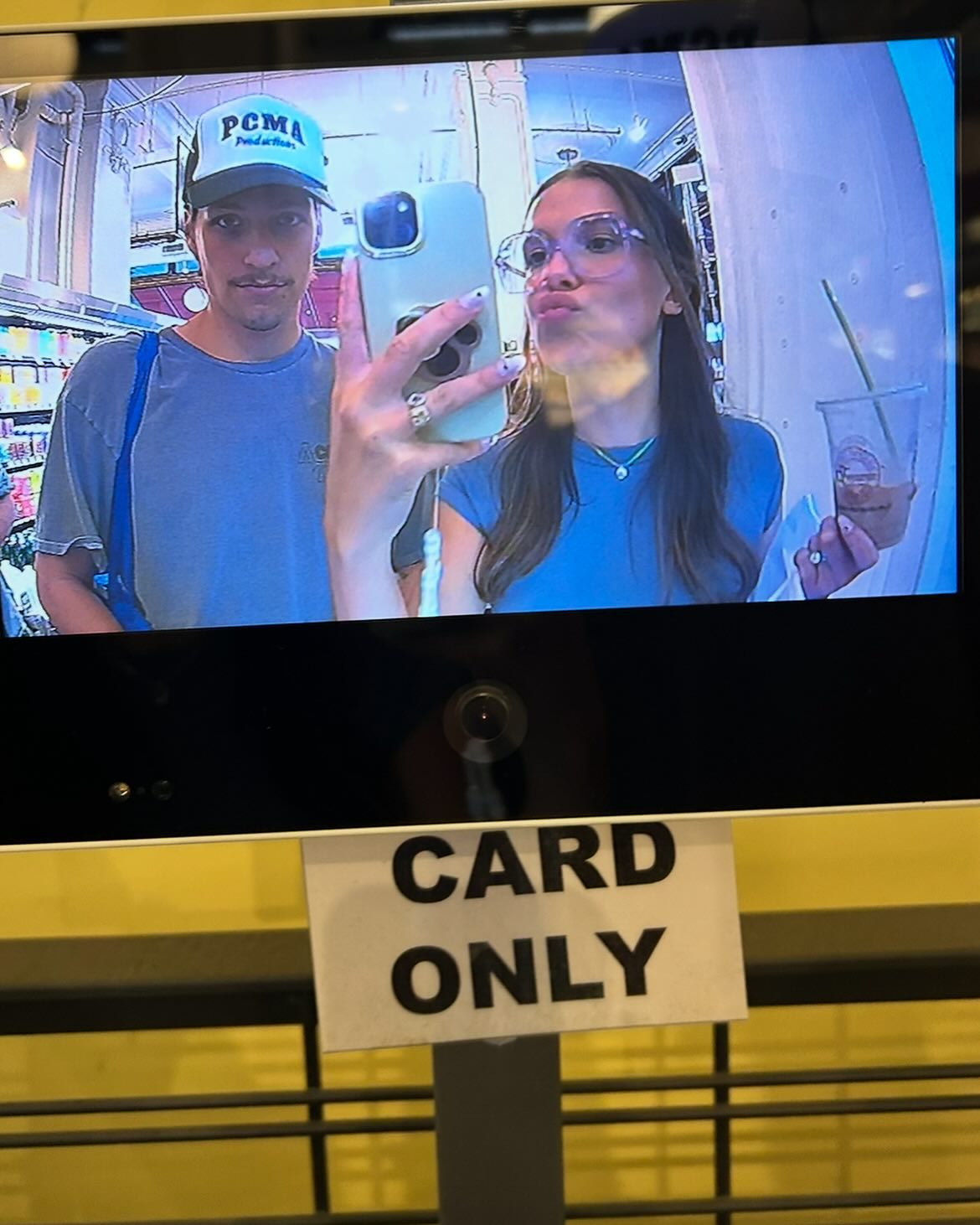 Millie Bobby Brown snaps a pic on a security camera with her husband Jake Bongiovi. 