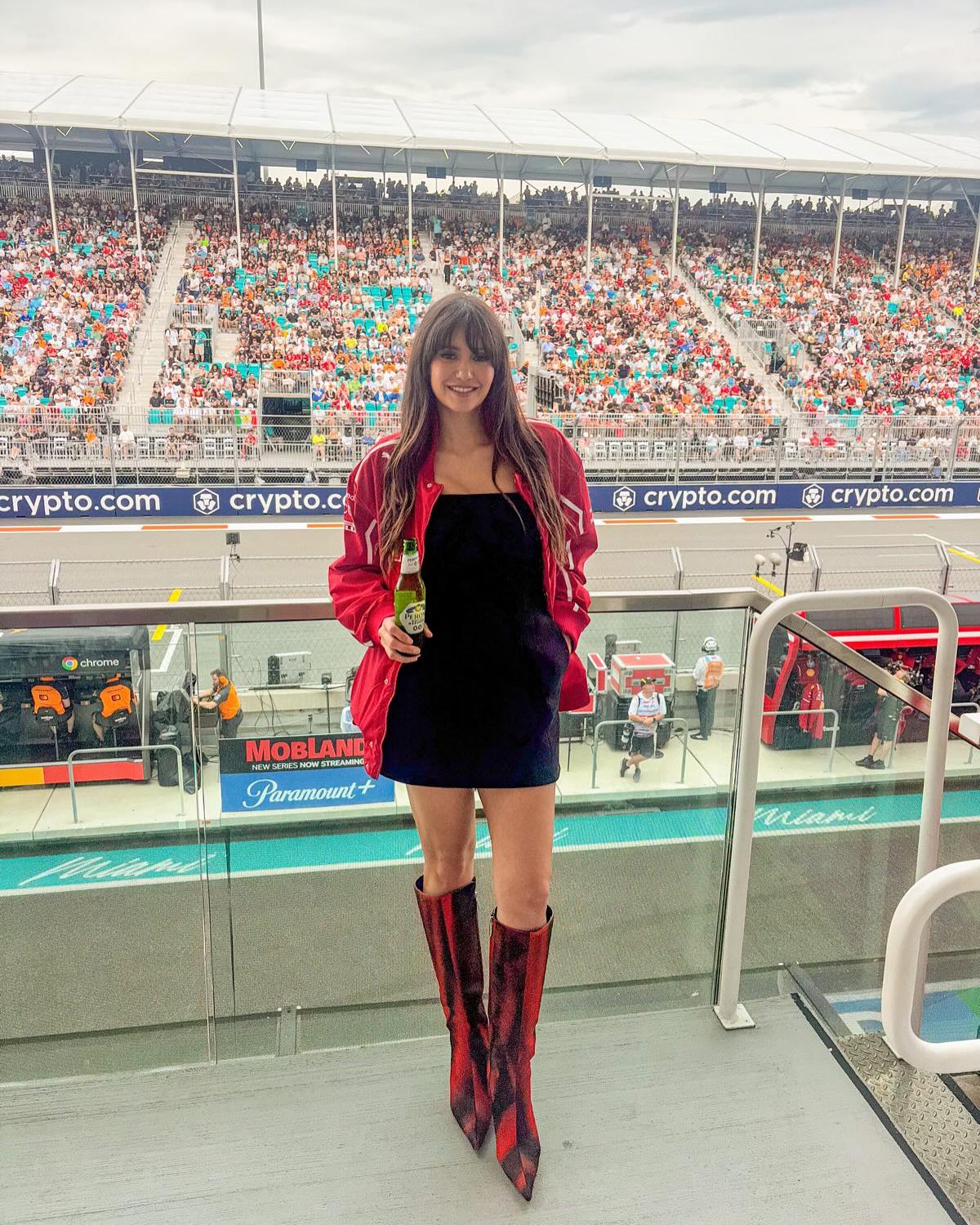 Nina Dobrev shows off her stylish fit while out at the F1 races.