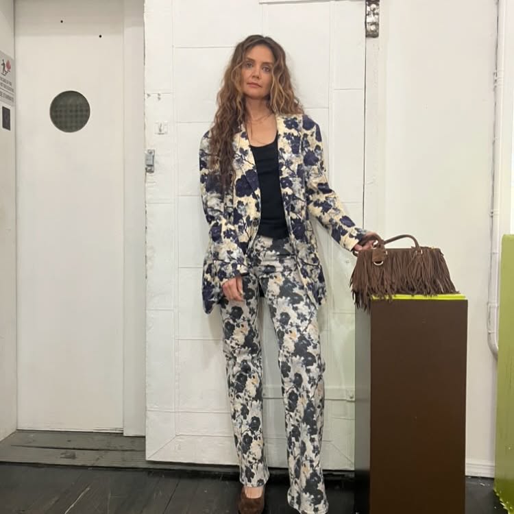 Katie Holmes embraces a floral pantsuit.