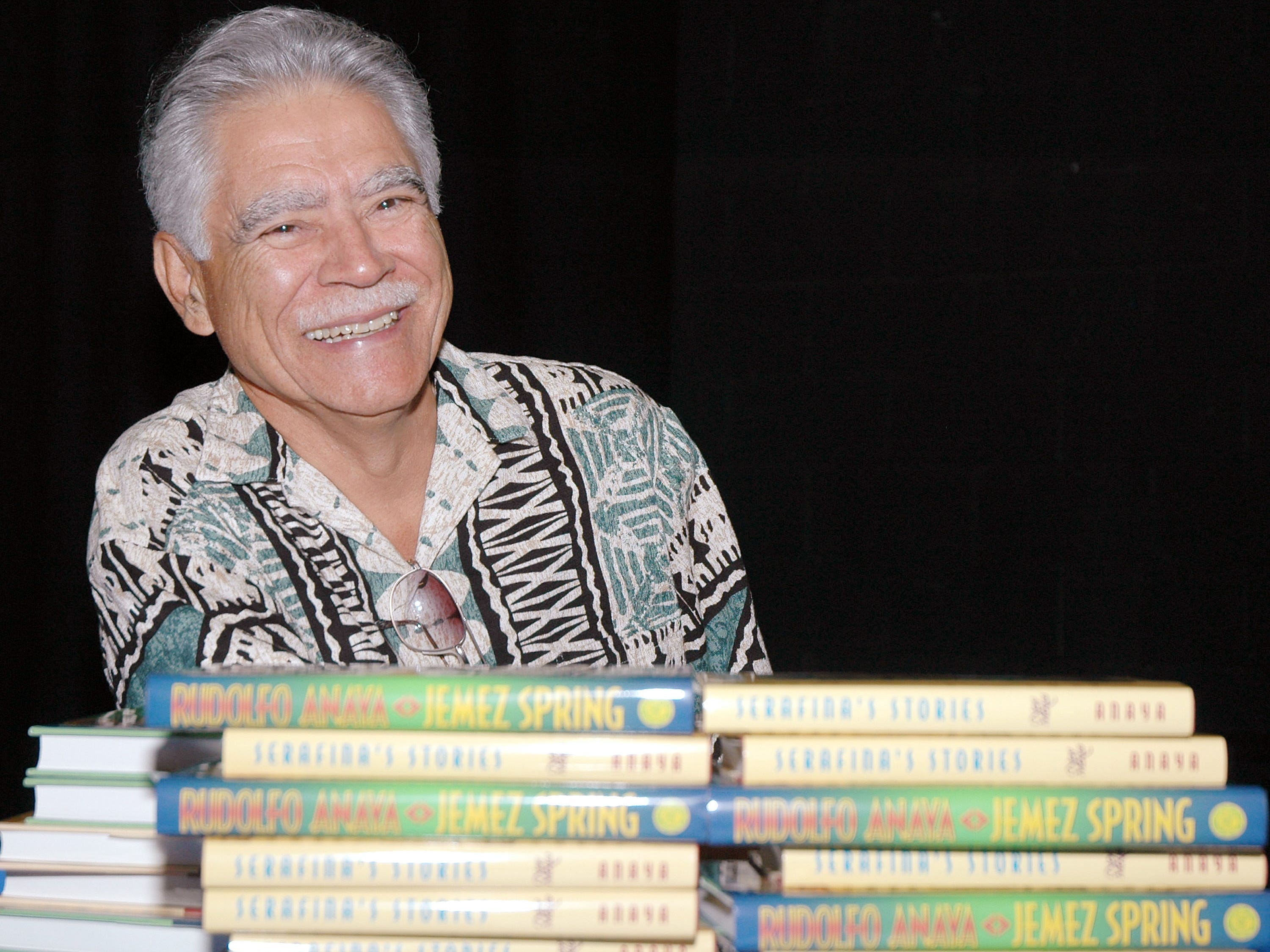 Author Rudolfo Anaya signs books for students and faculty at Bosque School on May 10, 2005