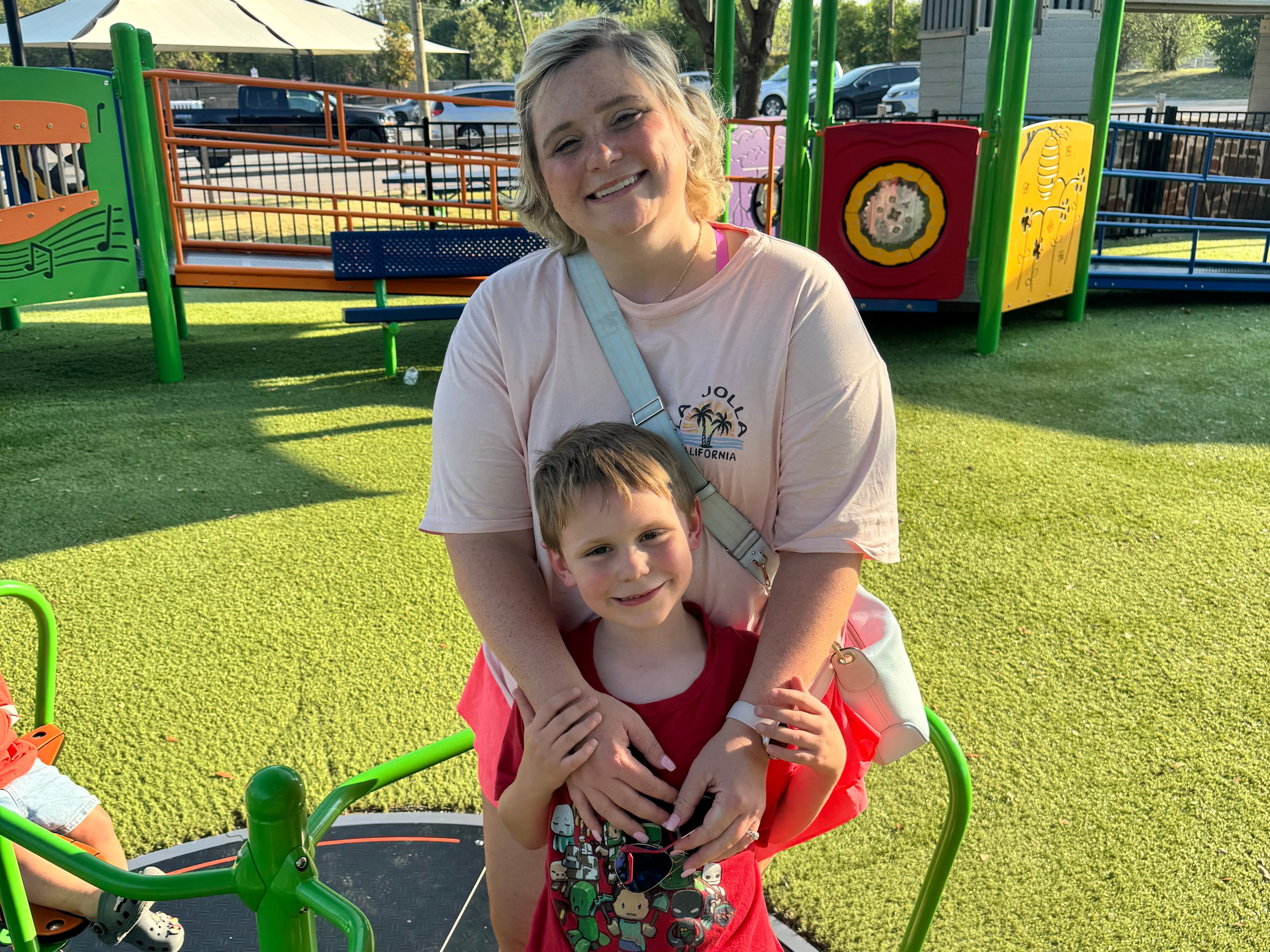 Mom and son posing for photo