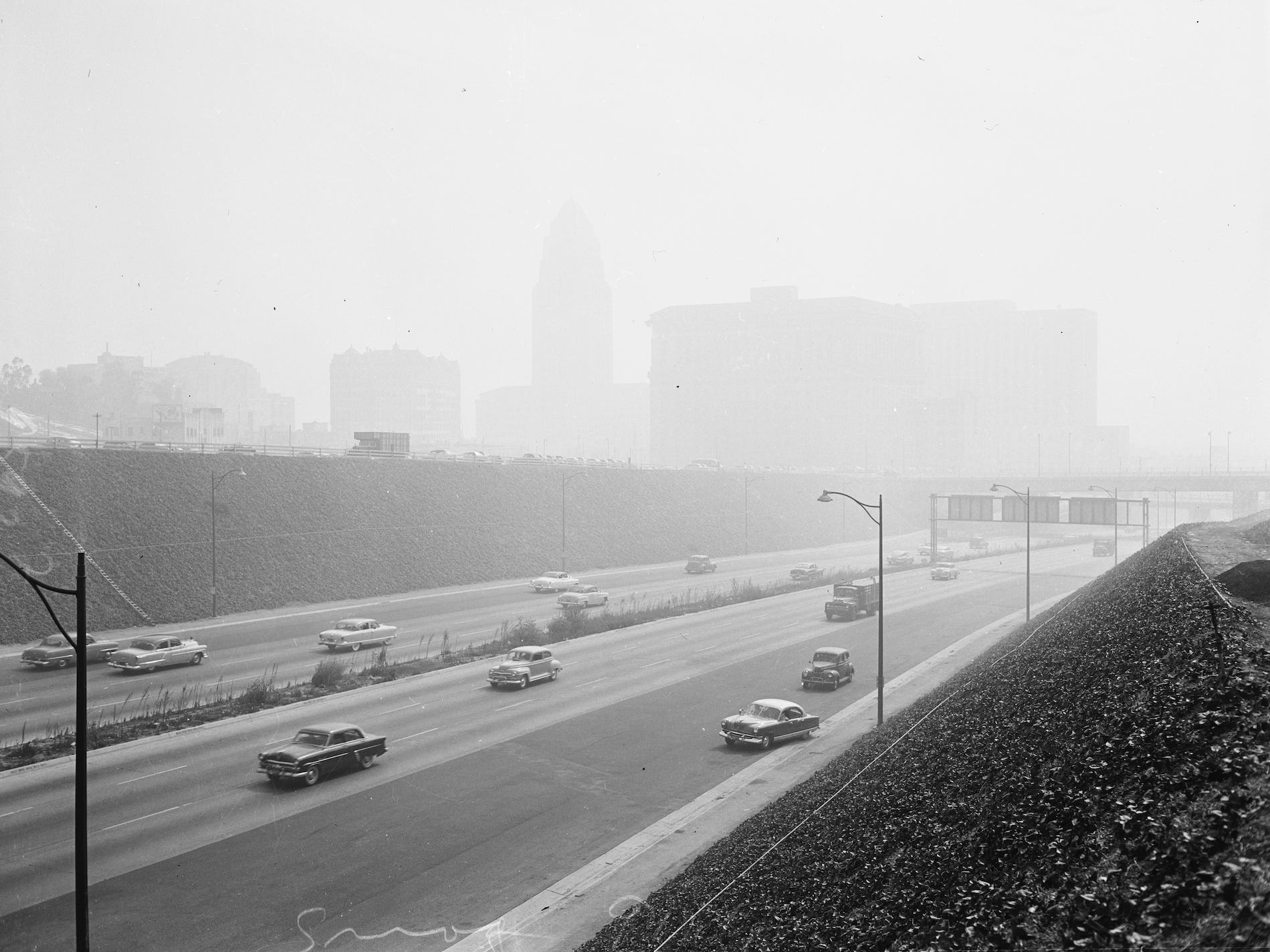 Los Angeles smog, 24 December 1948. Smog blanket over Los Angeles in vicinity of General Hospital;Showing top of smog blanket laying over city.