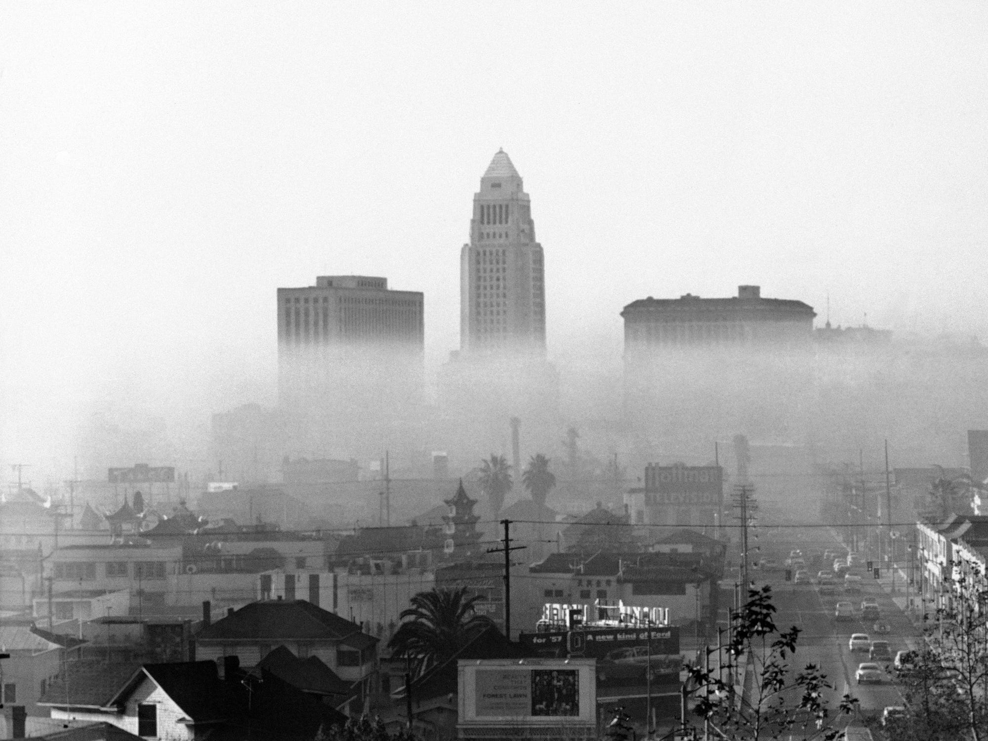 This is a view of Los Angeles on one of its frequent smoggy days, Dec. 11, 1958. On such days, a layer of warm air - temperature inversion - acts as a cover keeping impurities near the ground. Los Angeles officials claim automobiles cause most of the smog. Automotive and gasoline industries have been asked by the city to help in the fight against smog.