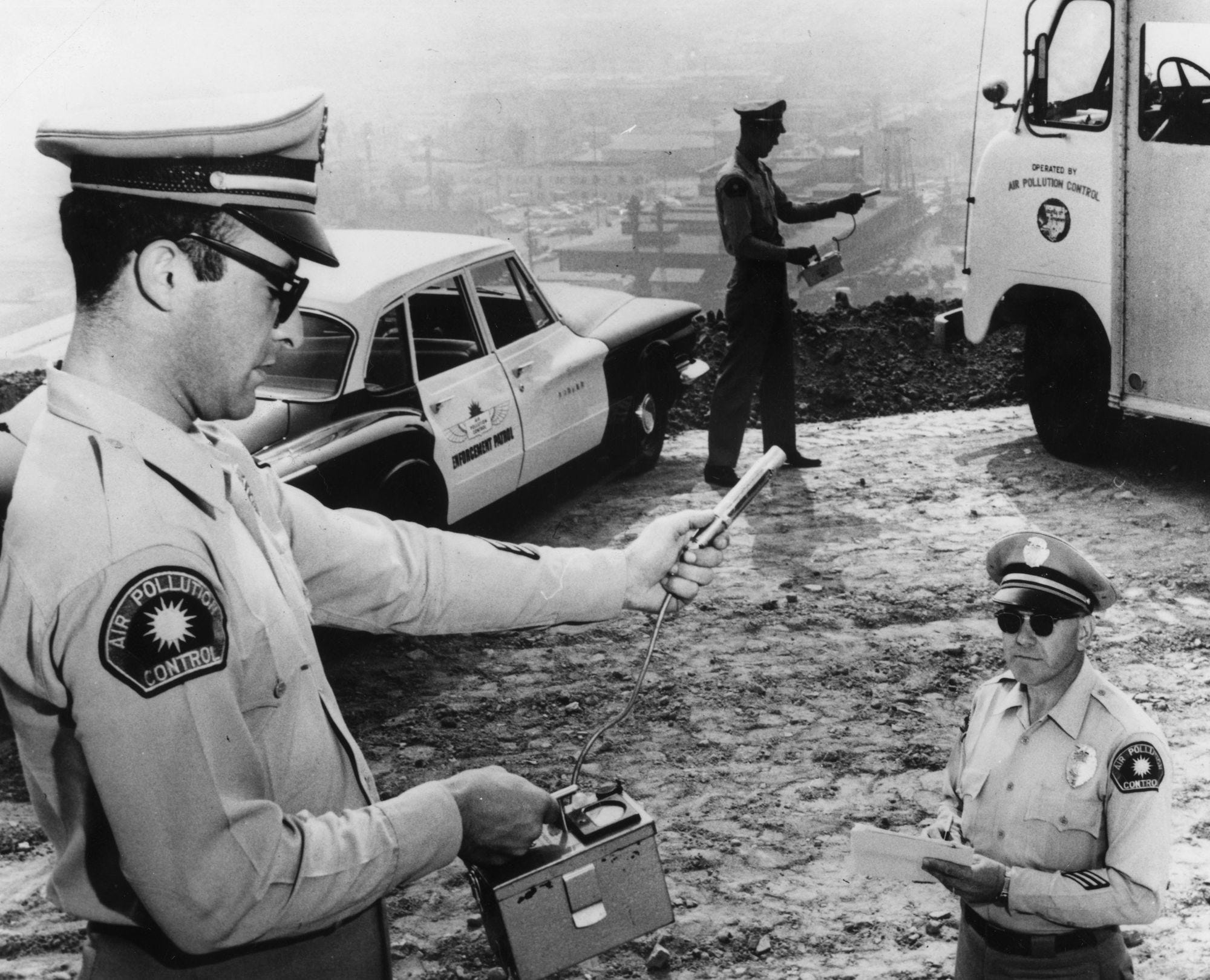 9th November 1961: Members of the 'Air Pollution Control' measure the concentration of atmospheric pollutants in Los Angeles, California.
