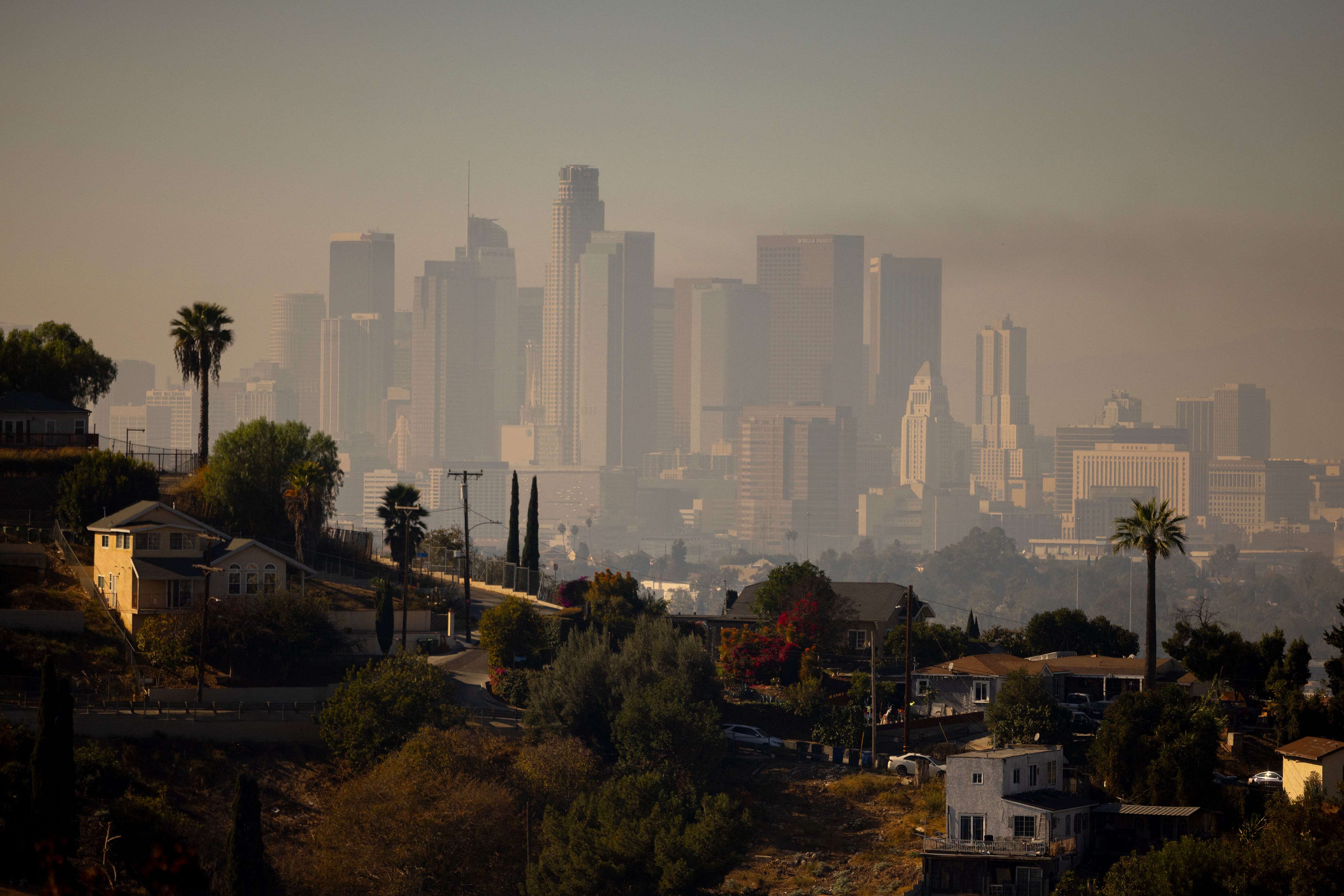 A layer of smog lingers above the downtown Los Angeles skyline on December 6, 2024. The National Weather Service on December 4 issued an air quality alert for the greater Los Angeles area until midnight on December 6.