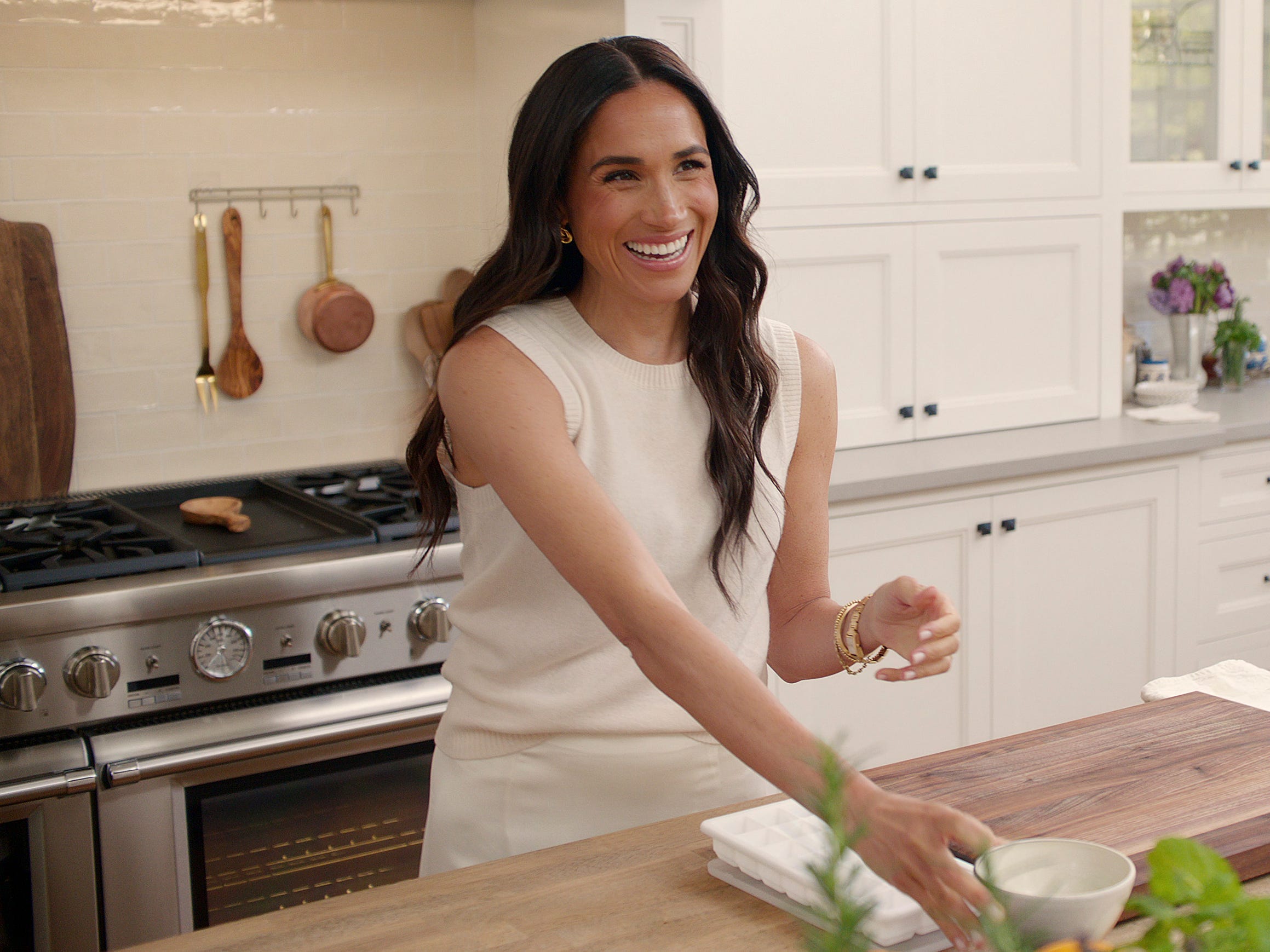 A photo of Meghan Markle in a kitchen.
