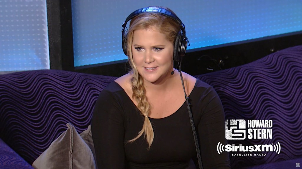 Amy Schumer on a podcast.