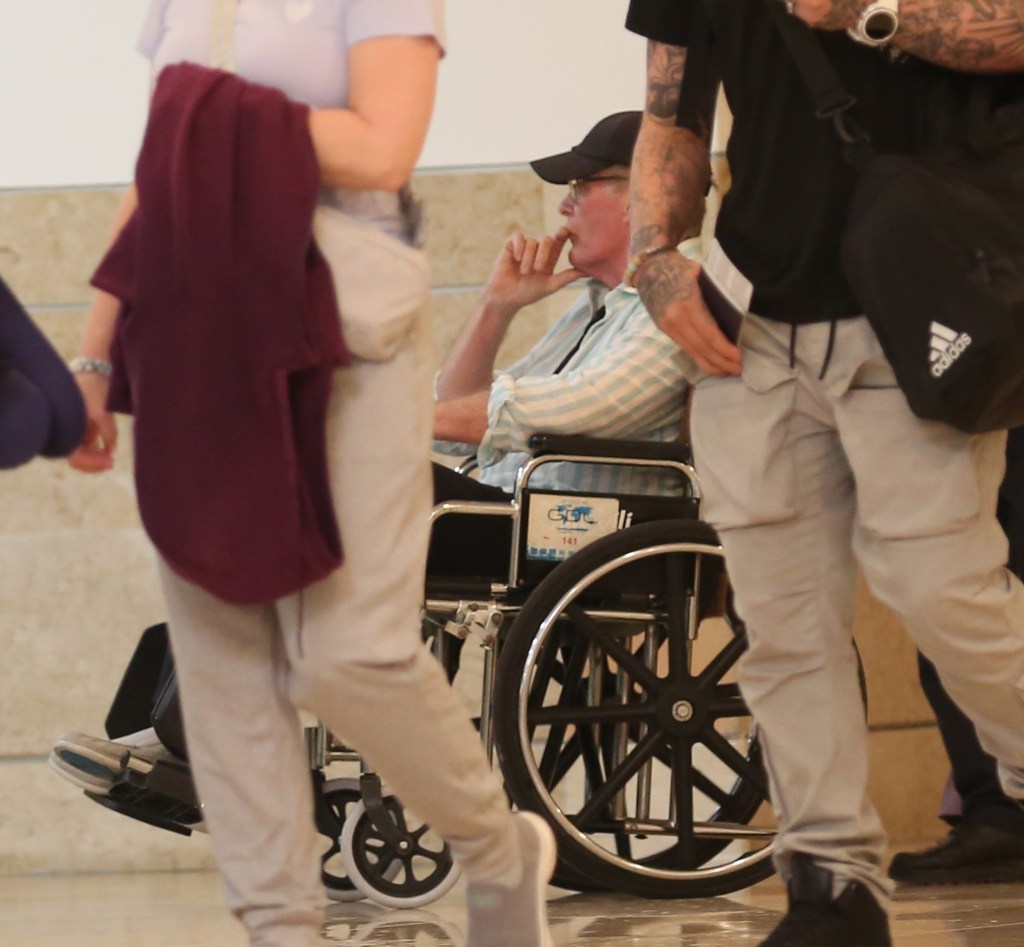 David Hasselhoff gets a helping hand in a wheelchair as he and Hayley Roberts wrap up their sun-soaked getaway in Cancun, Mexico.