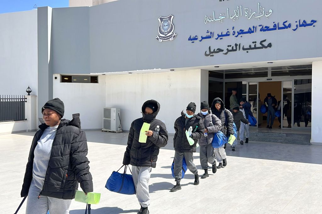 Nigerian migrants exiting the Office of Deportations, prepped for deportation at Mitiga International Airport in Tripoli, Libya, March 18, 2025.