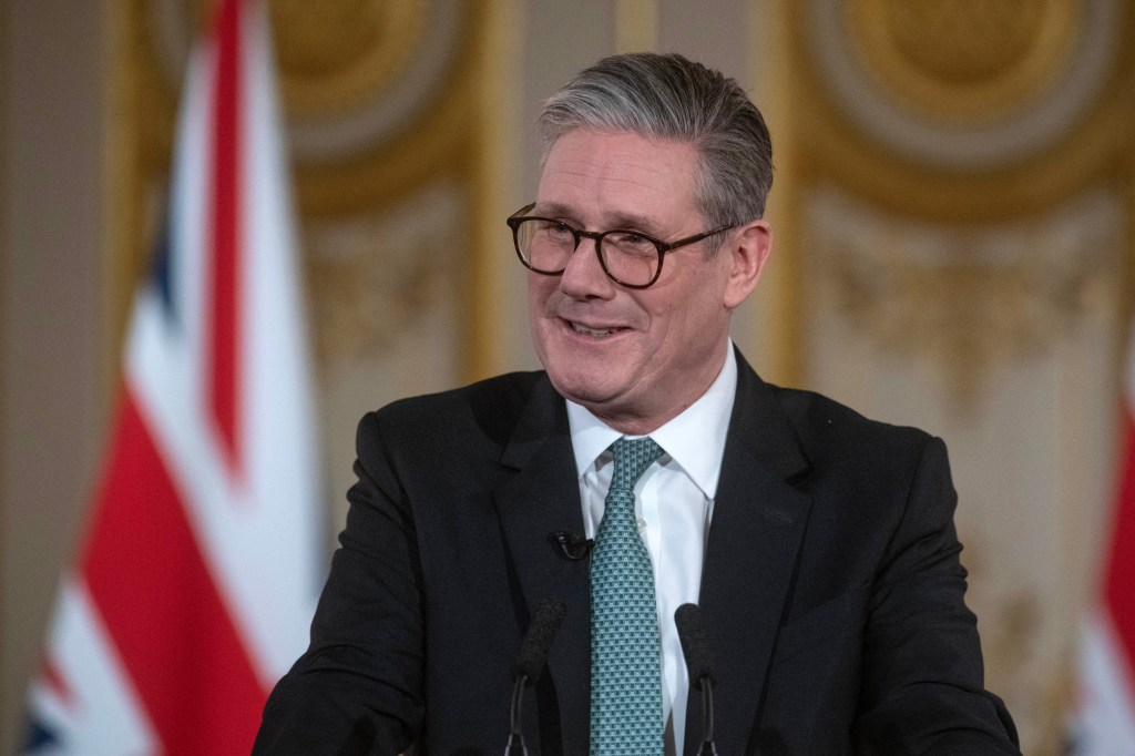 Britain's Prime Minister Keir Starmer smiles during a press conference after hosting a summit of European leaders at Lancaster House in central London on March 2, 2025. 
