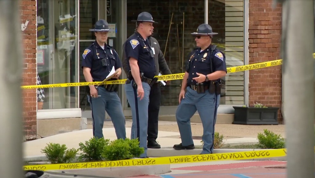 Police investigate the officer involved shooting outside the courthouse on May 6, 2025.