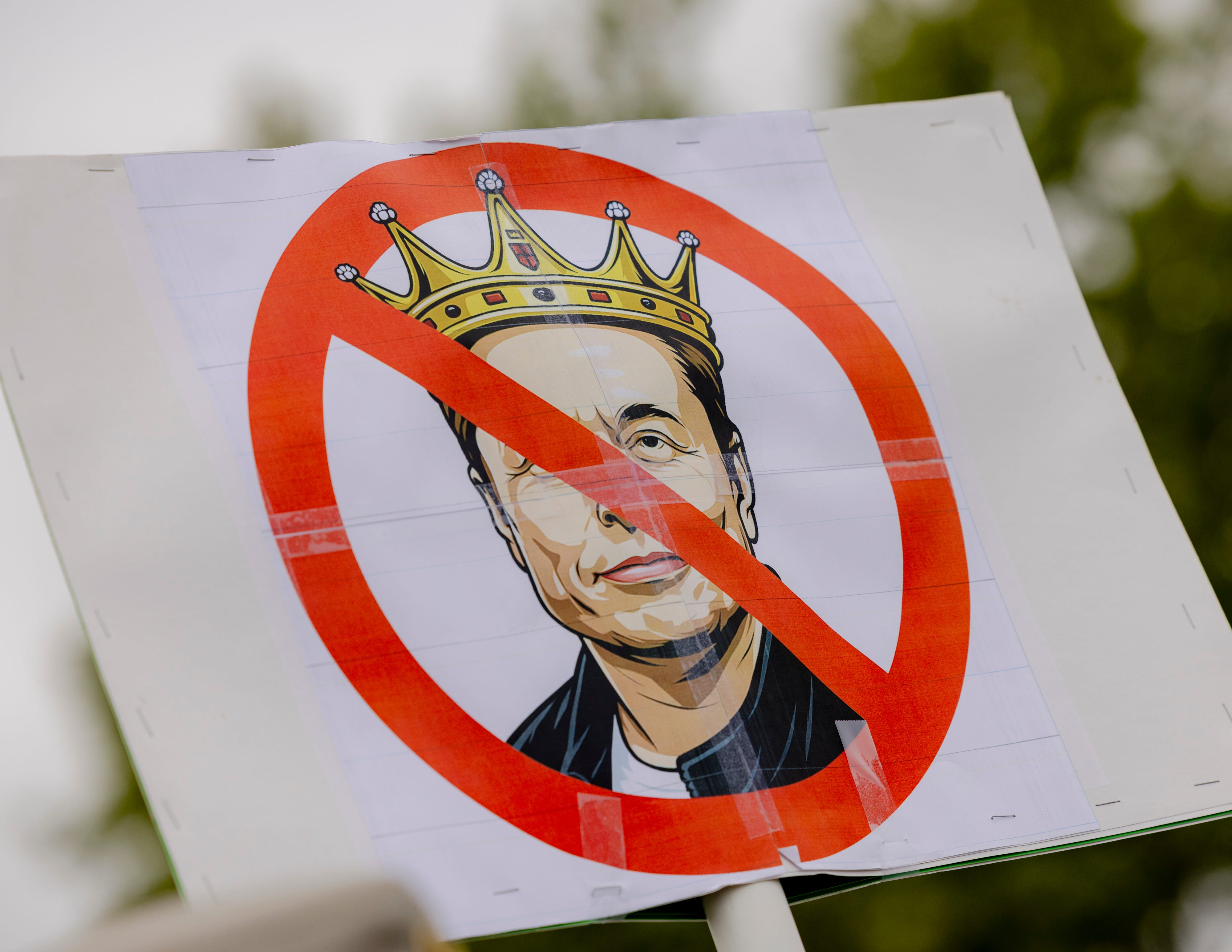 Protester sign of Elon Musk.