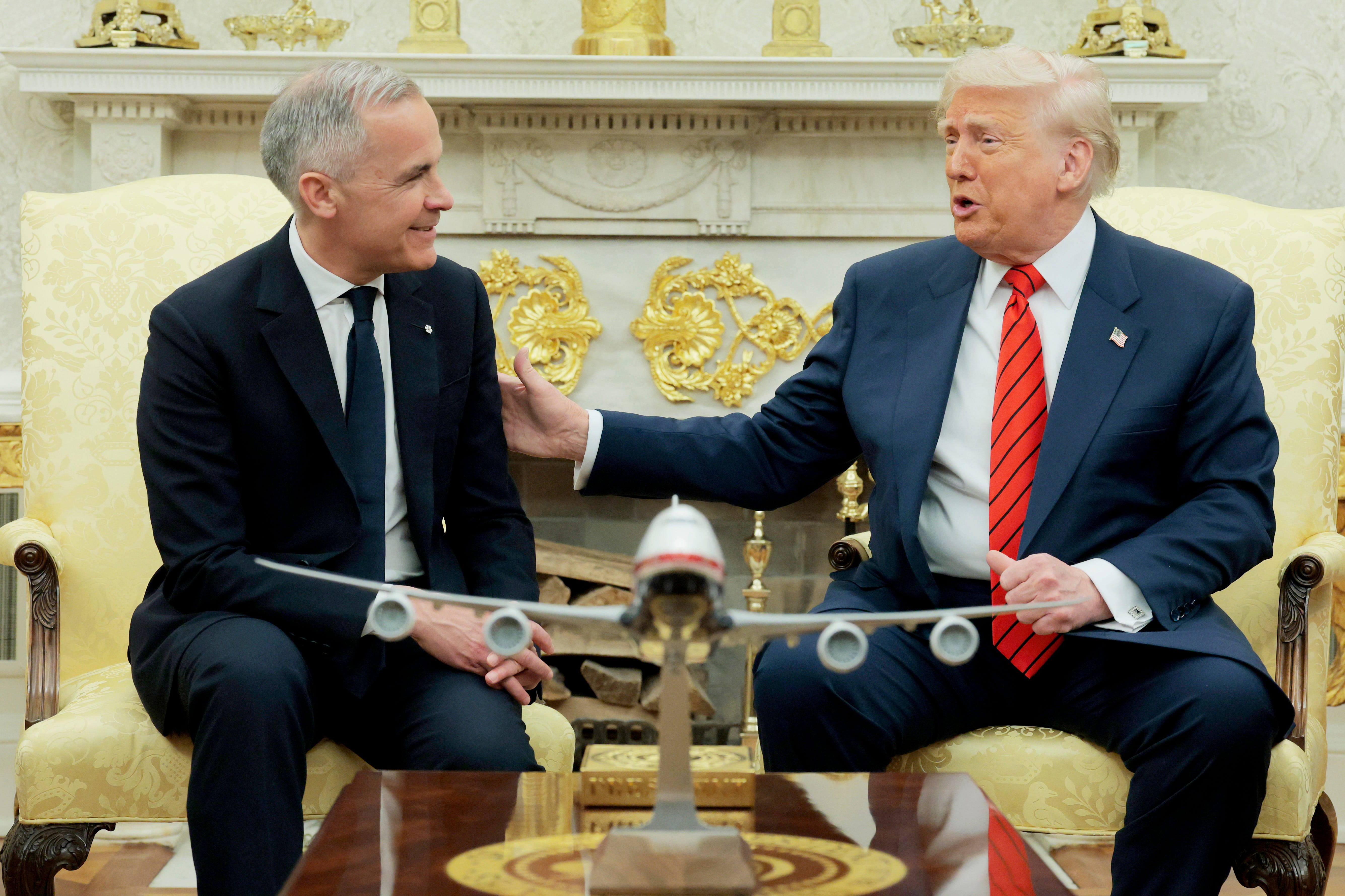 President Donald Trump and Canadian Prime Minister Mark Carney sit iin the Oval office.