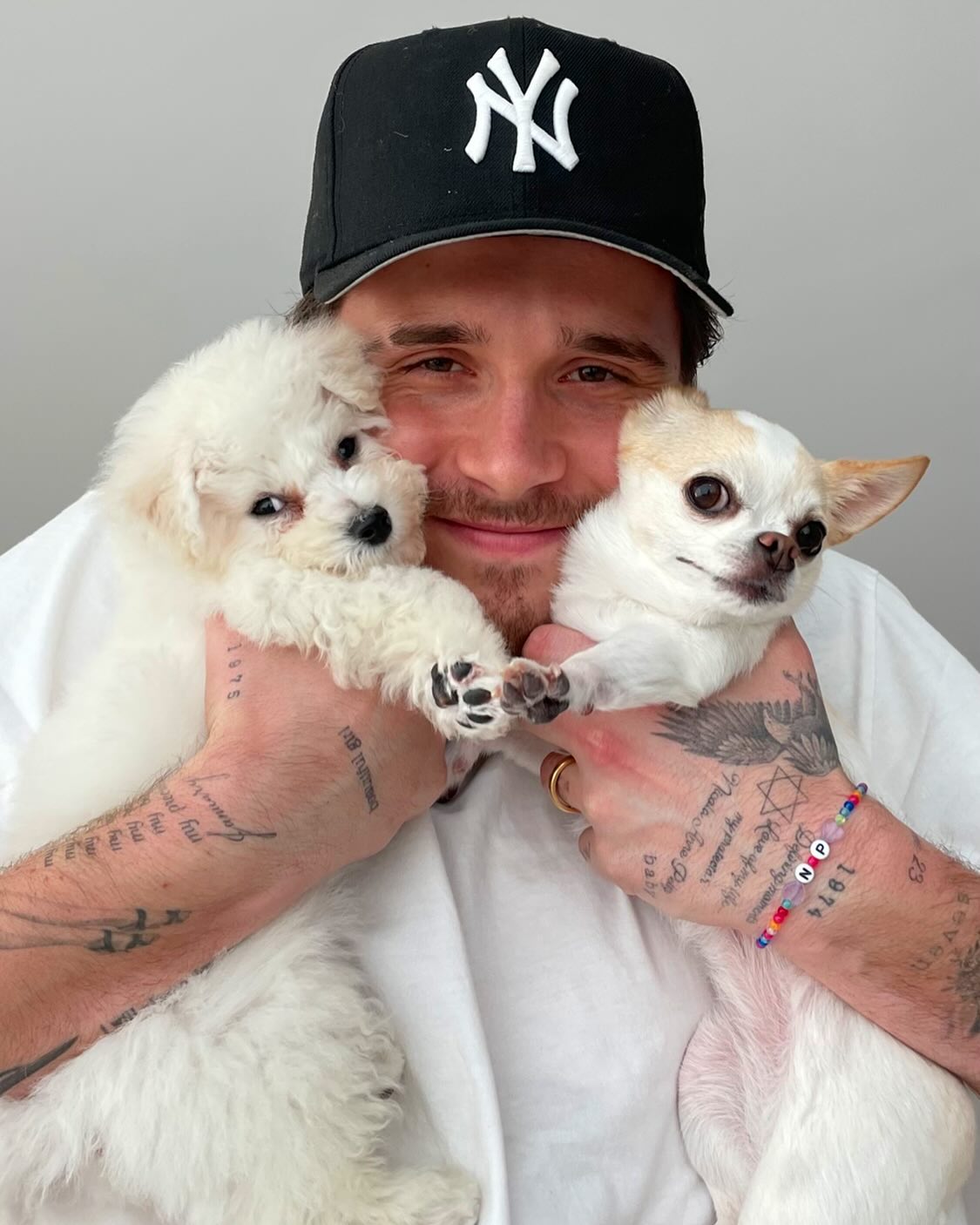 Brooklyn Beckham holds his late dog Bear.