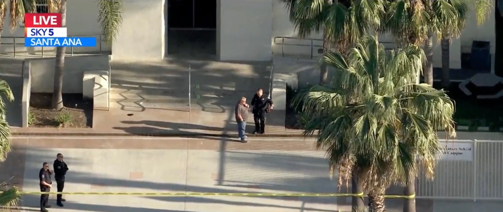 Police officers responding to a stabbing incident outside Santa Ana High School