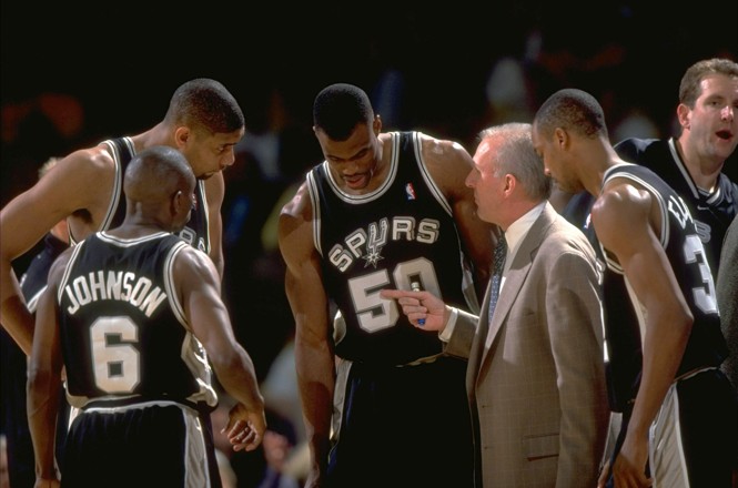 NBA Playoffs, San Antonio Spurs coach Gregg Popovich with David Robinson (50), Tim Duncan (21), and Avery Johnson (6) on sidelines during game vs Los Angeles Lakers, Inglewood, CA 5/22/1999