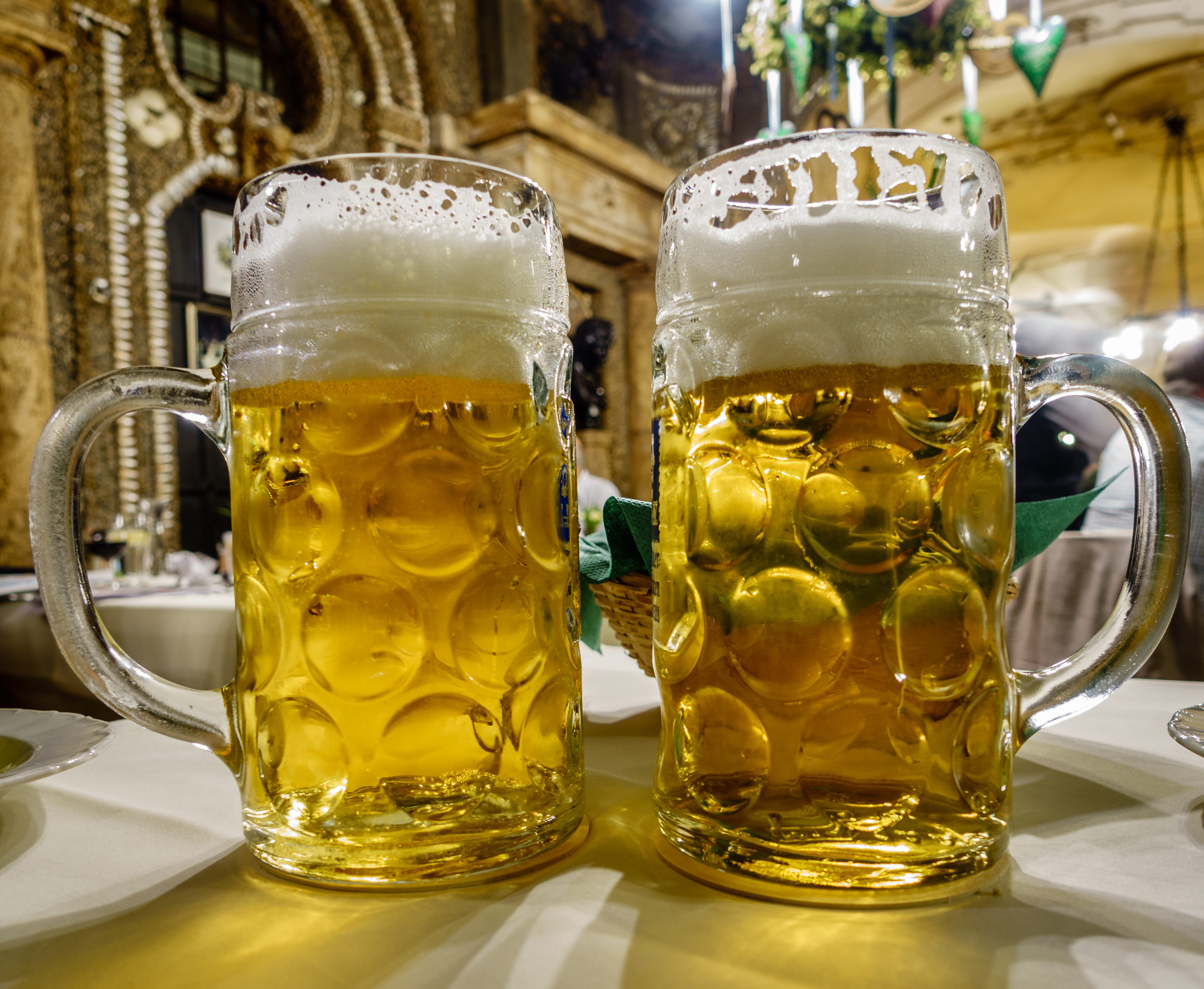 Two mugs of beer in restaurant in Munich
