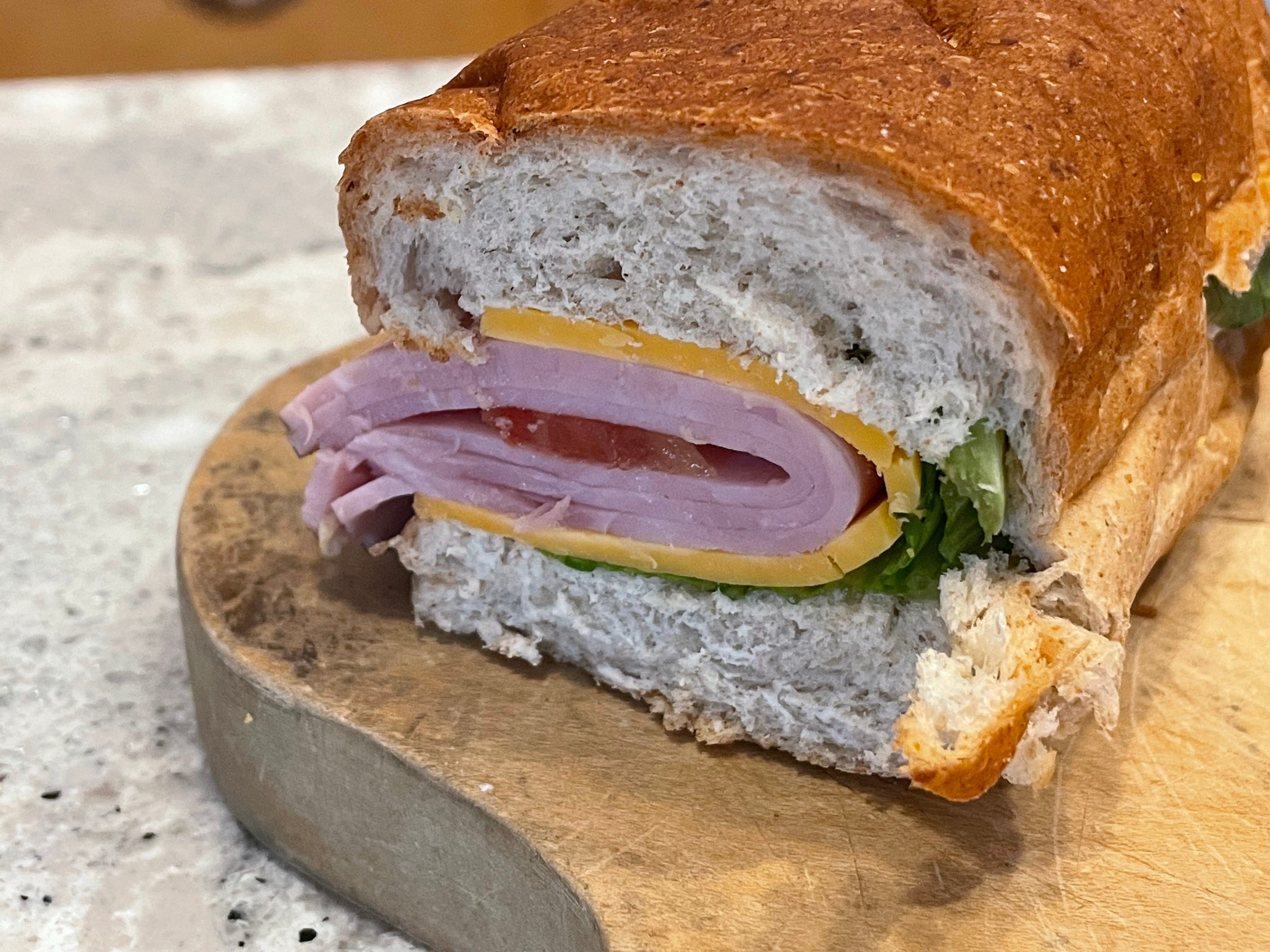 A close-up of the author's ham and cheddar sandwich from QuikTrip.