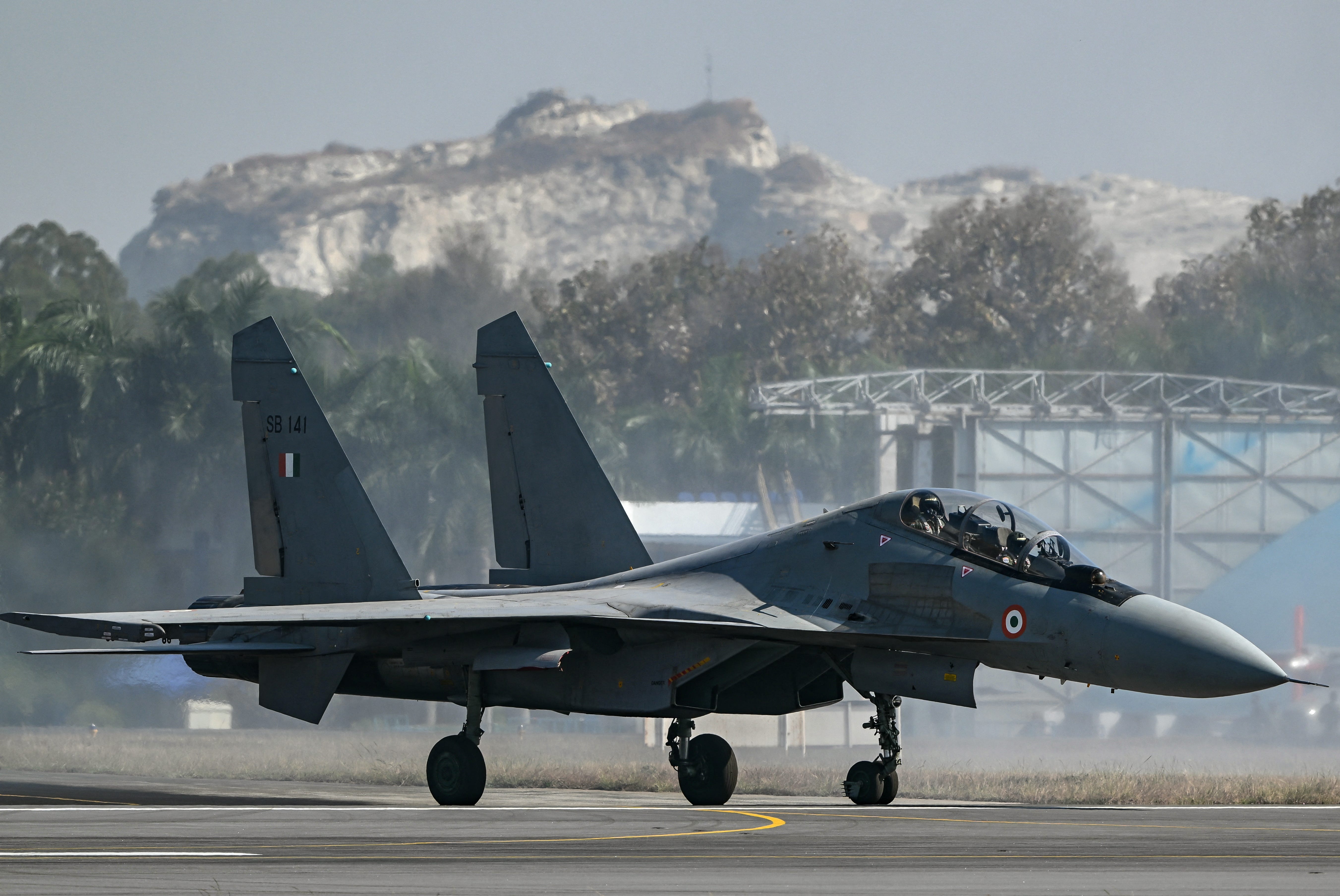 An Indian Air Force (IAF) Sukhoi Su-30MKI fighter jet prepares to take off during Aero India 2025, a military aviation exhibition at the Yelahanka Air Force Station in Bengaluru on February 13, 2025.