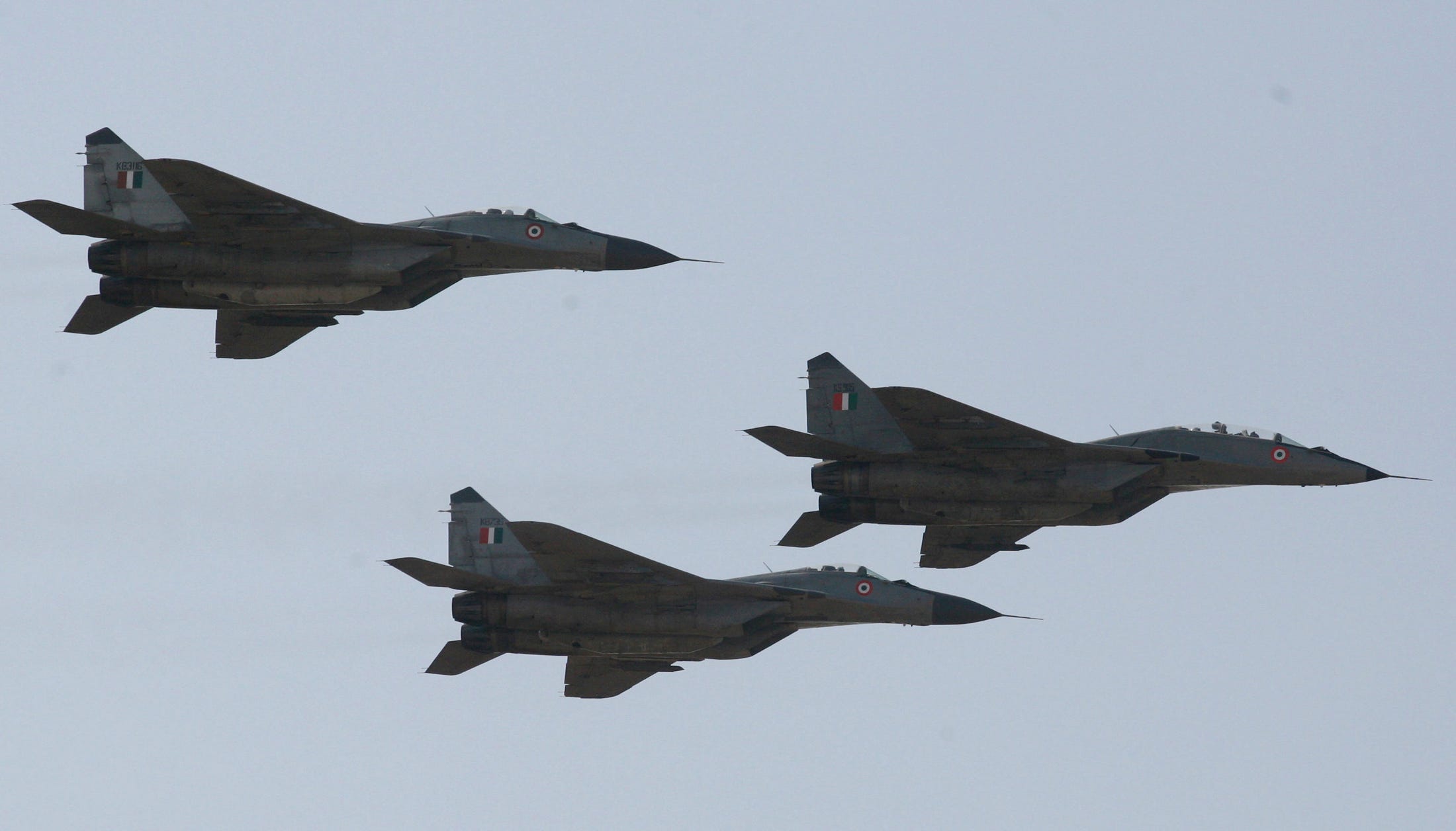 Indian air force MIG-29 aircrafts fly during an air show at the Bhuj airbase, about 350 km (217 miles) west from the western Indian city of Ahmedabad February 15, 2007.