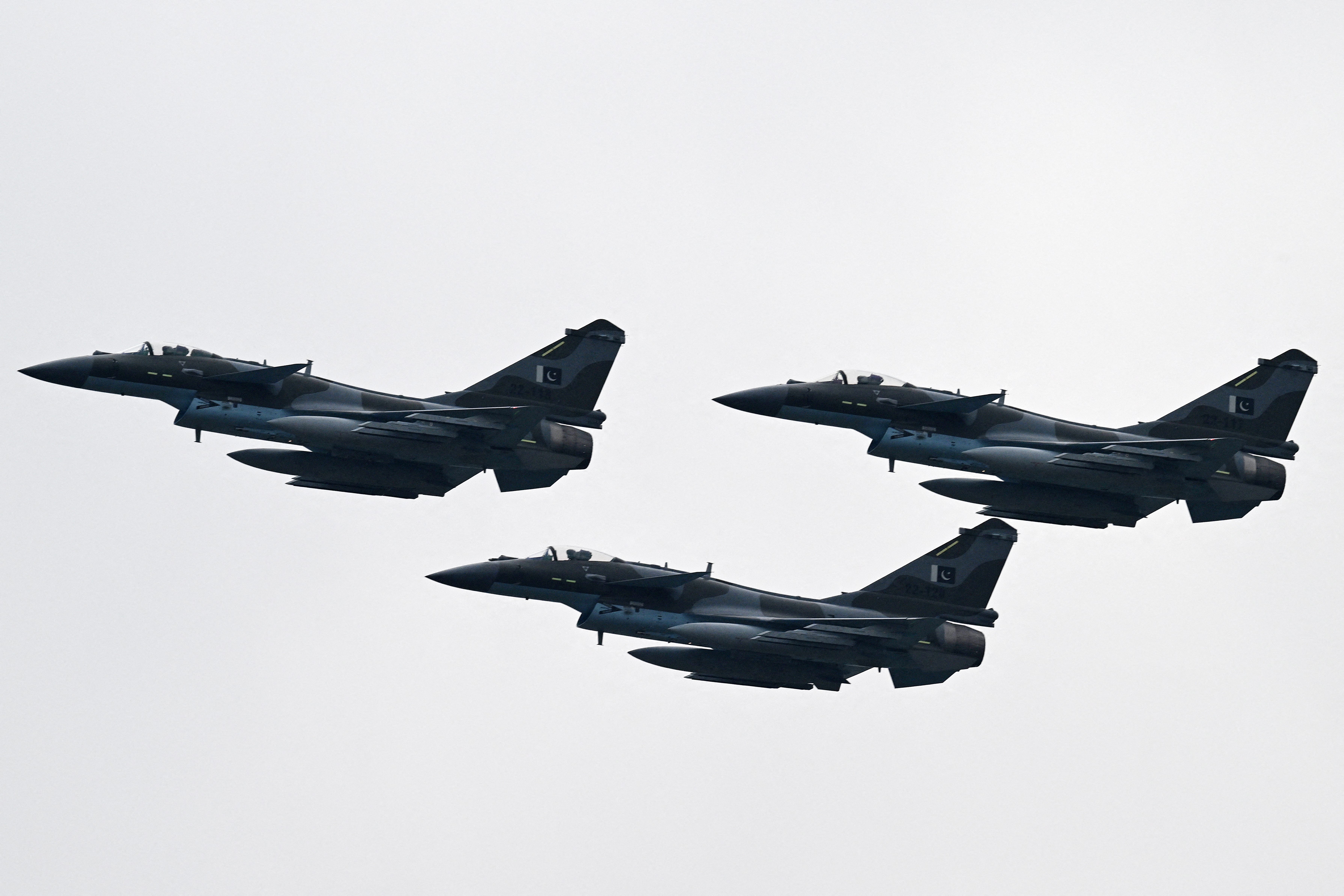 Pakistan Air Force J-10C fighter jets perform at a rehearsal ahead of Pakistan's national day parade in Islamabad on March 21, 2024.