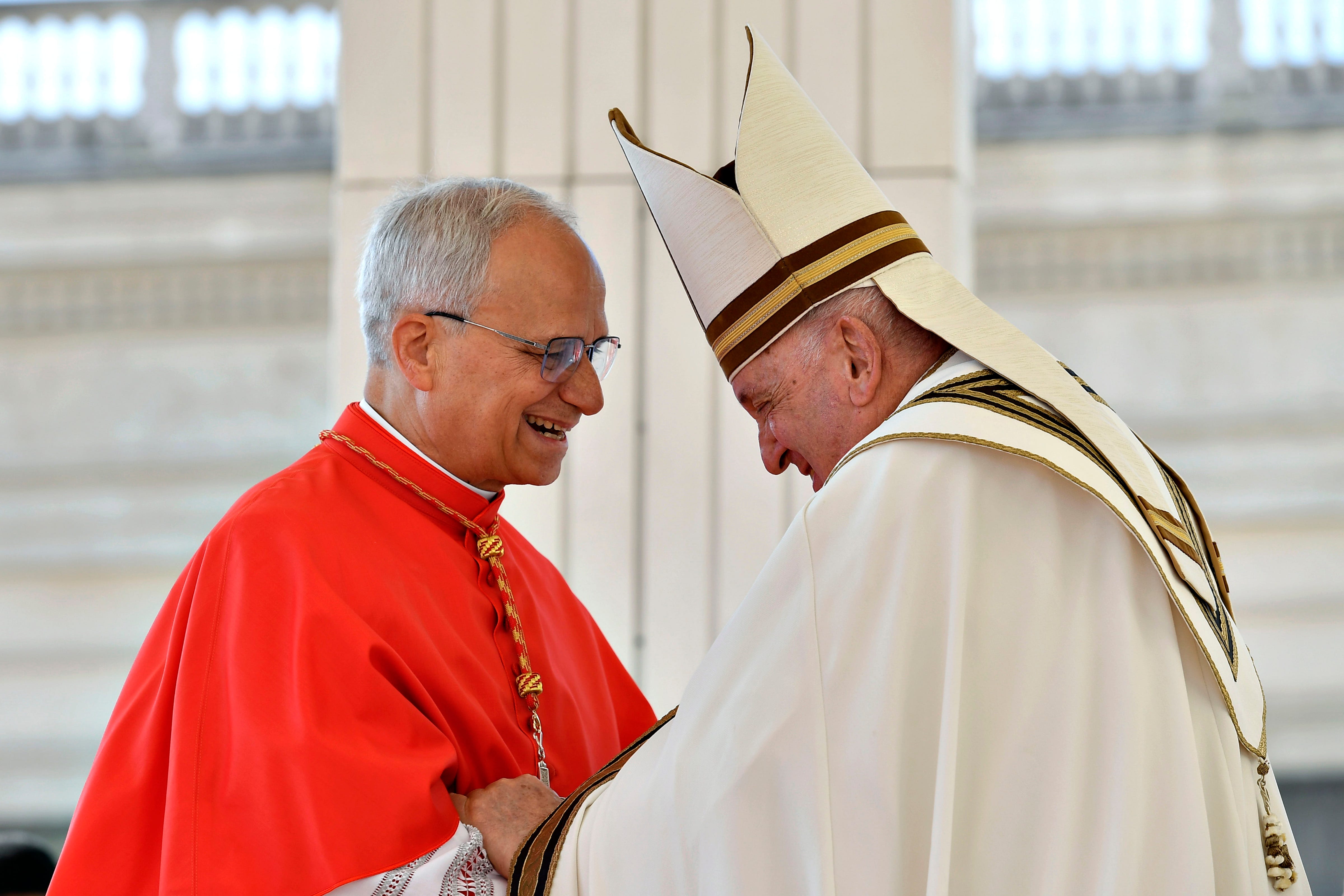 Pope Francis and Cardinal Robert Francis Prevost smile together