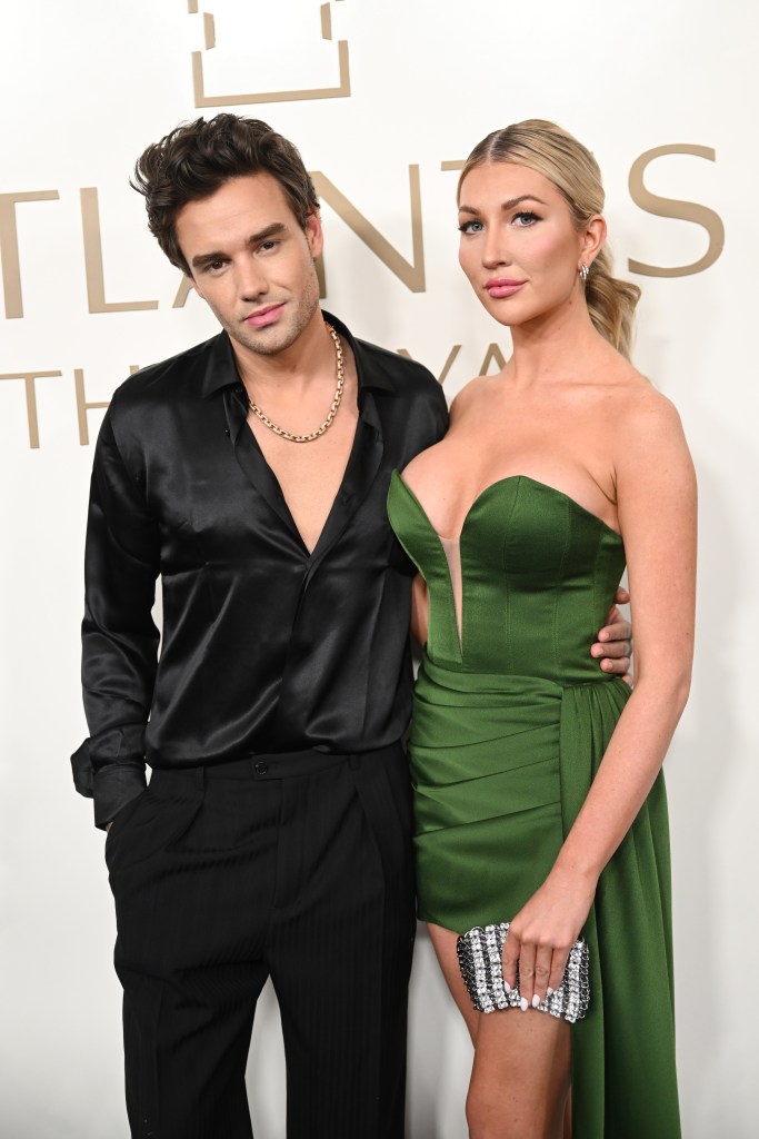 Liam Payne with his arm around Kate Cassidy's waist