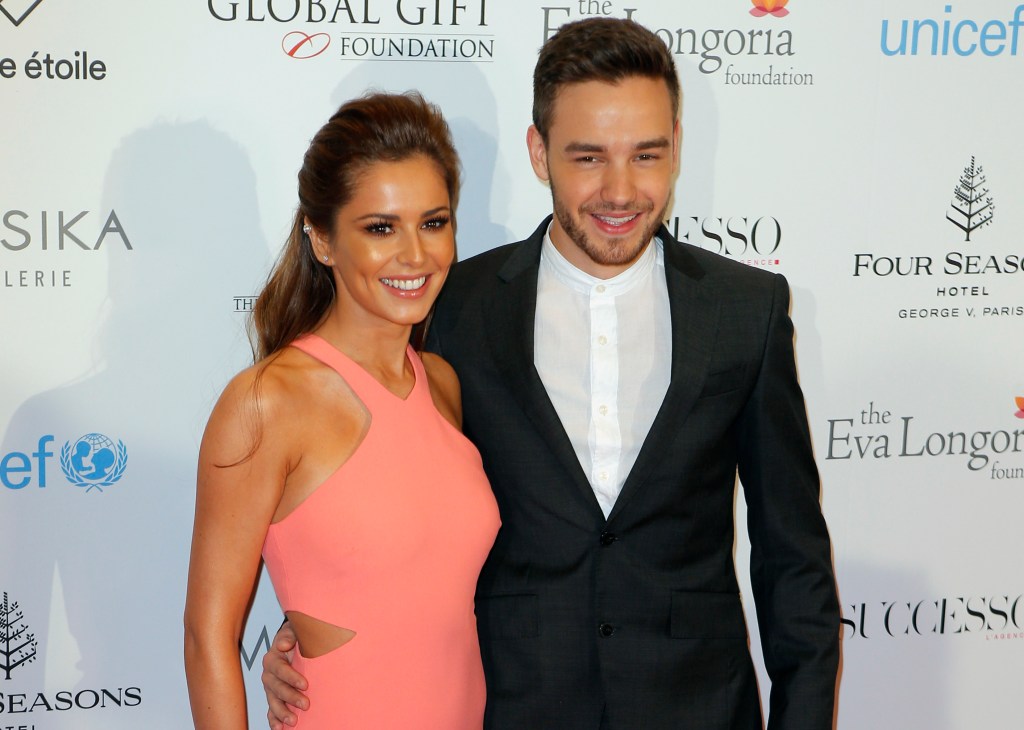 Cheryl in a pink cut out gown, Liam Payne in a black suit and white shirt.