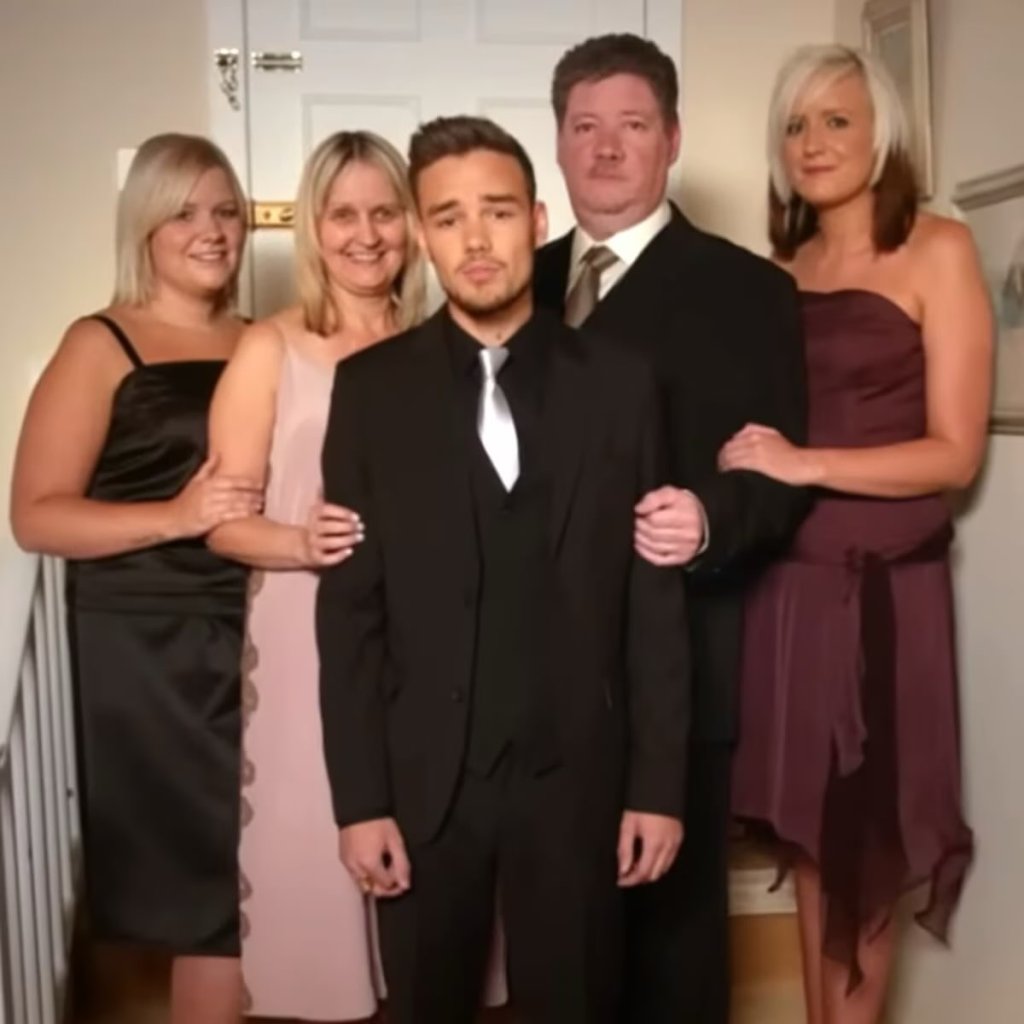 Liam Payne in a black suit, black shirt and silver tie. Geoff Payne in a black site, white shirt and silver tie. Karen Payne in a pink dress, Nicola Payne in a burgundy dress, Ruth Gibbons in a black dress.