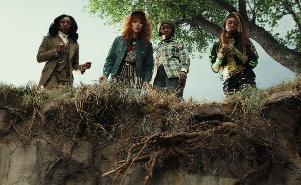 Natasha Lyonne surrounded by Cynthia Erivos looking over a cliff