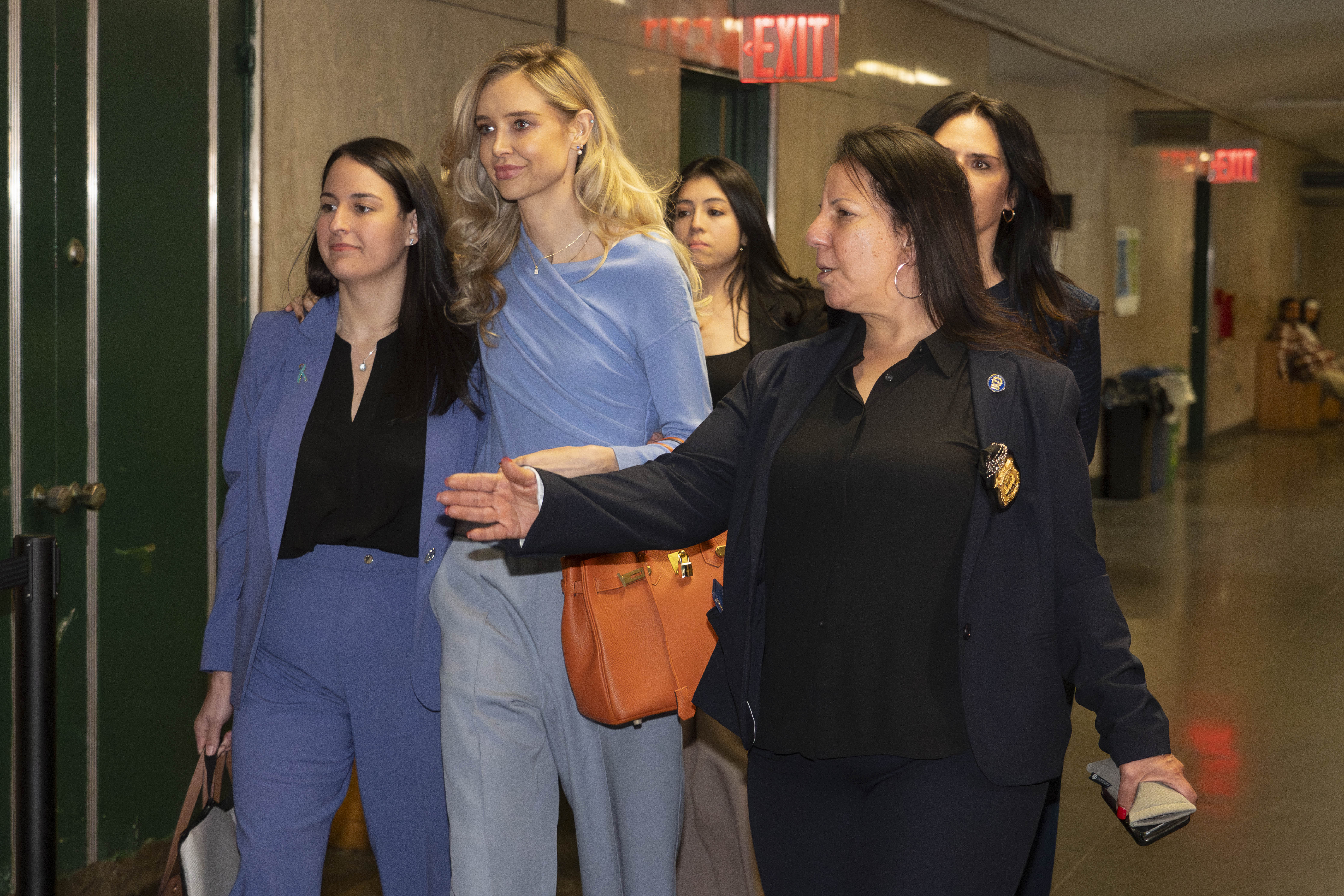 Kaja Sokola outside court with supporters. 