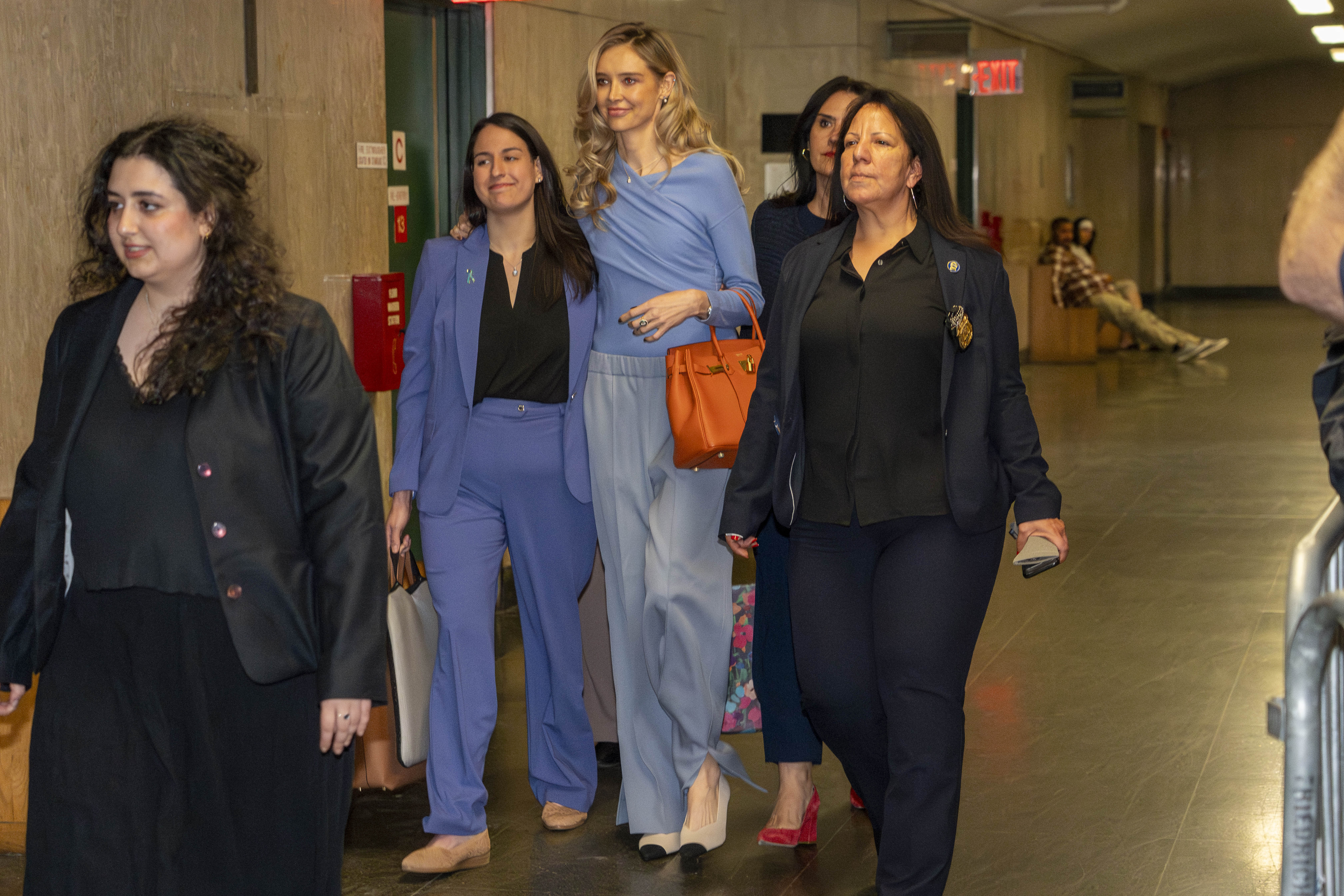 Kaja Sokola walking in a hallway at court. 
