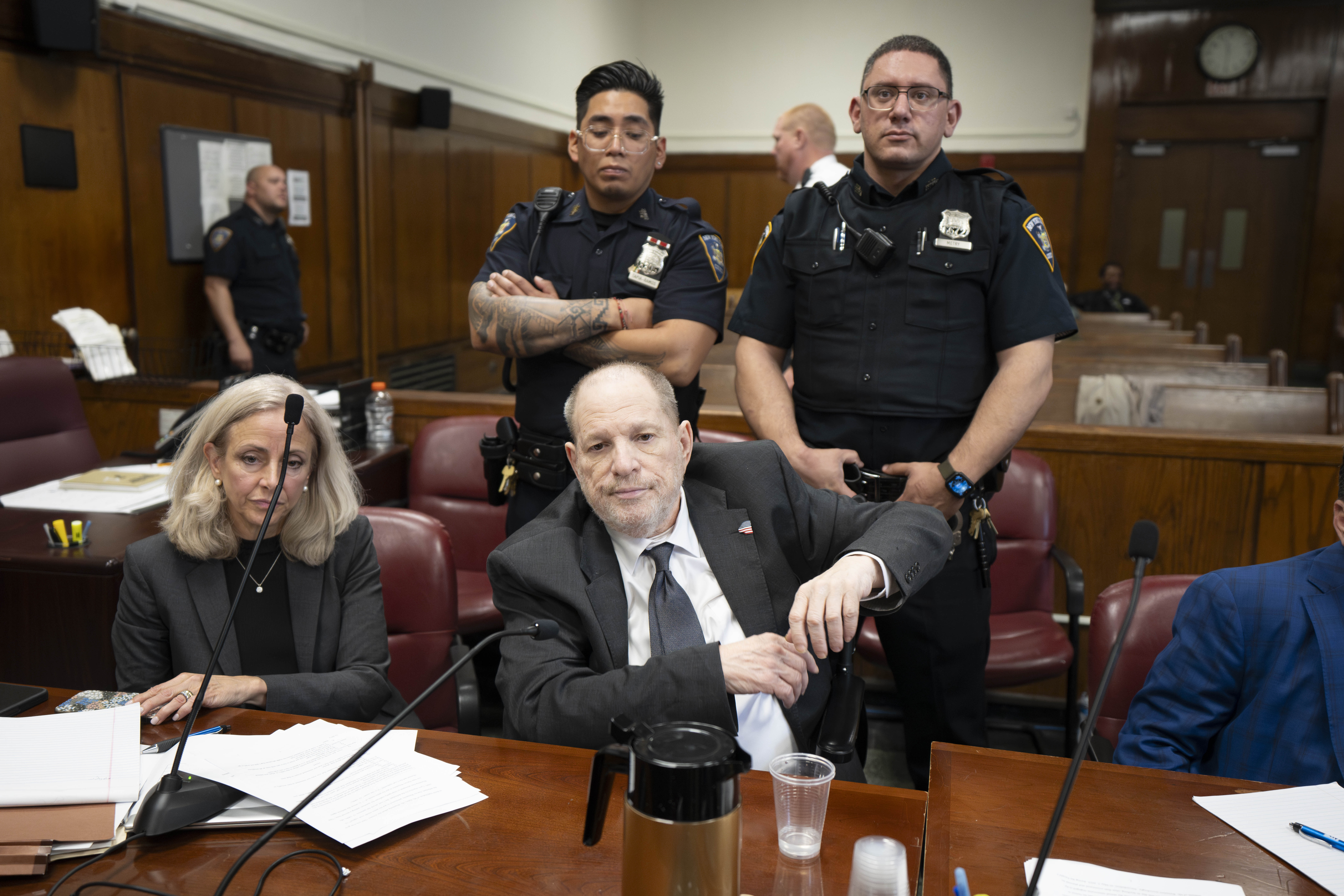 Harvey Weinstein leans back during court. 
