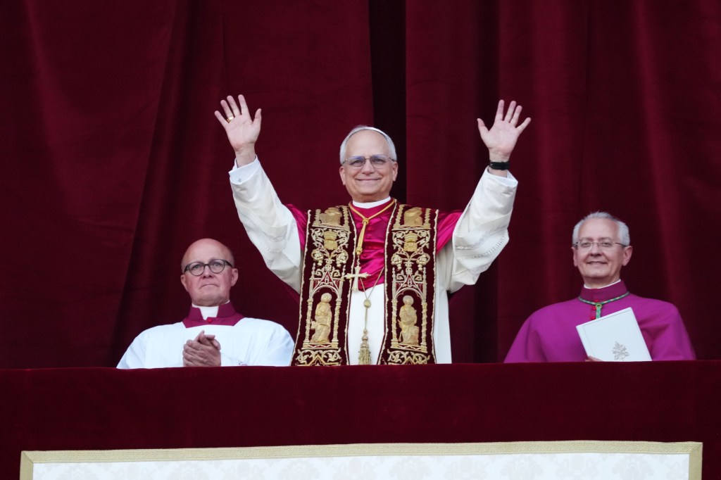 The newly elected Pontiff, Pope Leo XIV is seen for the first time from the Vatican balcony on May 8, 2025 in Vatican City, Vatican. 