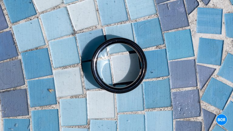 Top-down view of the Oura Ring 4 on a blue table