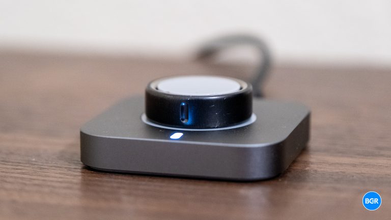 Oura Ring 4 on its charging dock.