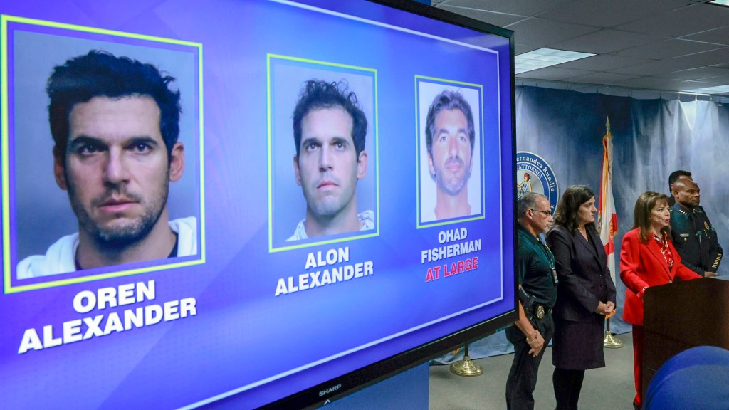Federal prosecutors have filed a superseding indictment against three luxury Miami businessmen.