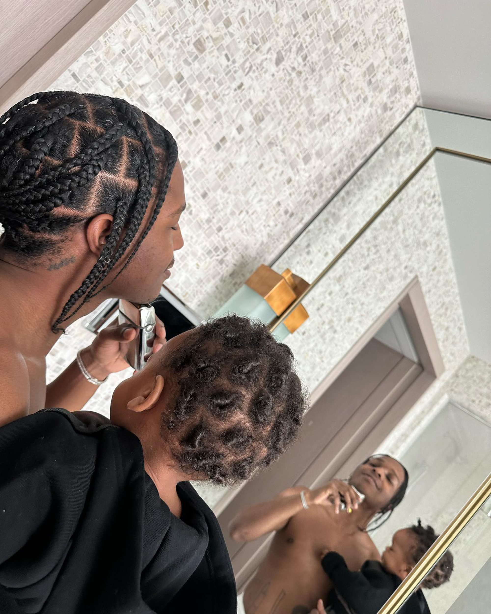 ASAP Rocky holds son RZA.