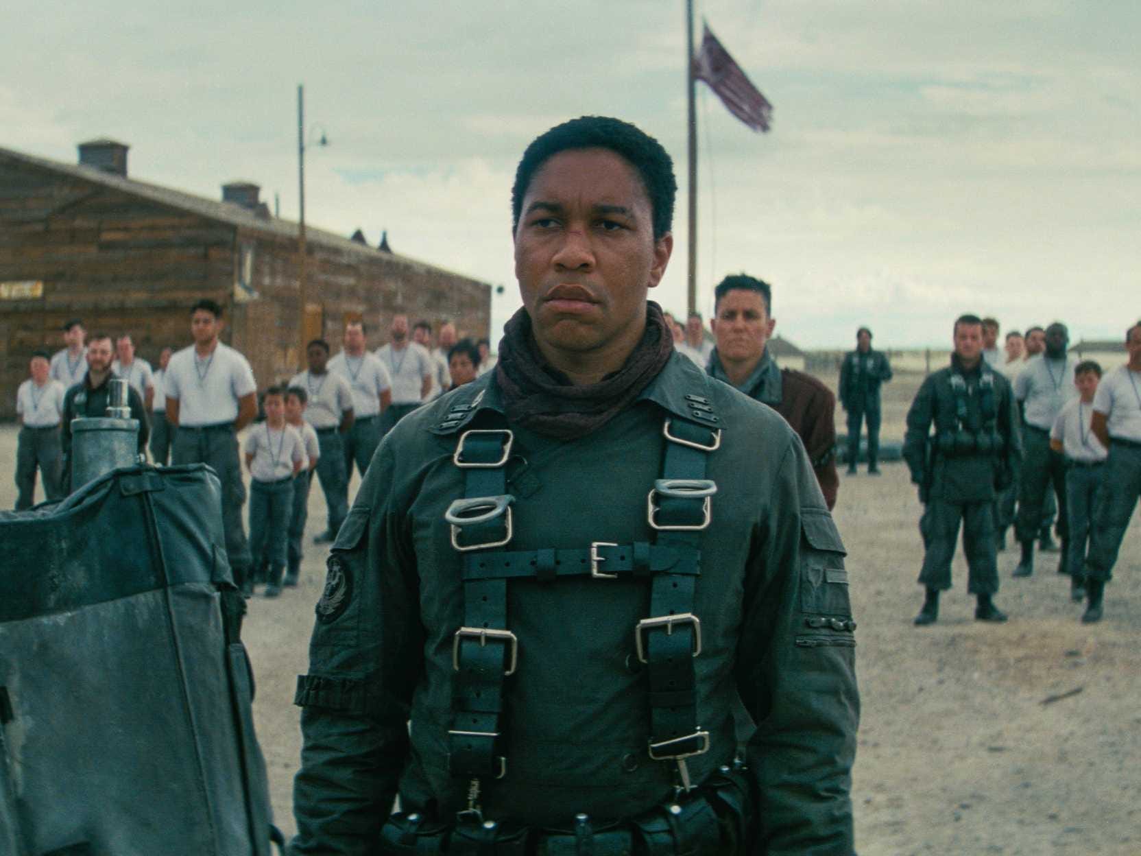 Actor Aaron Moten wears a green uniform in a scene from "Fallout"