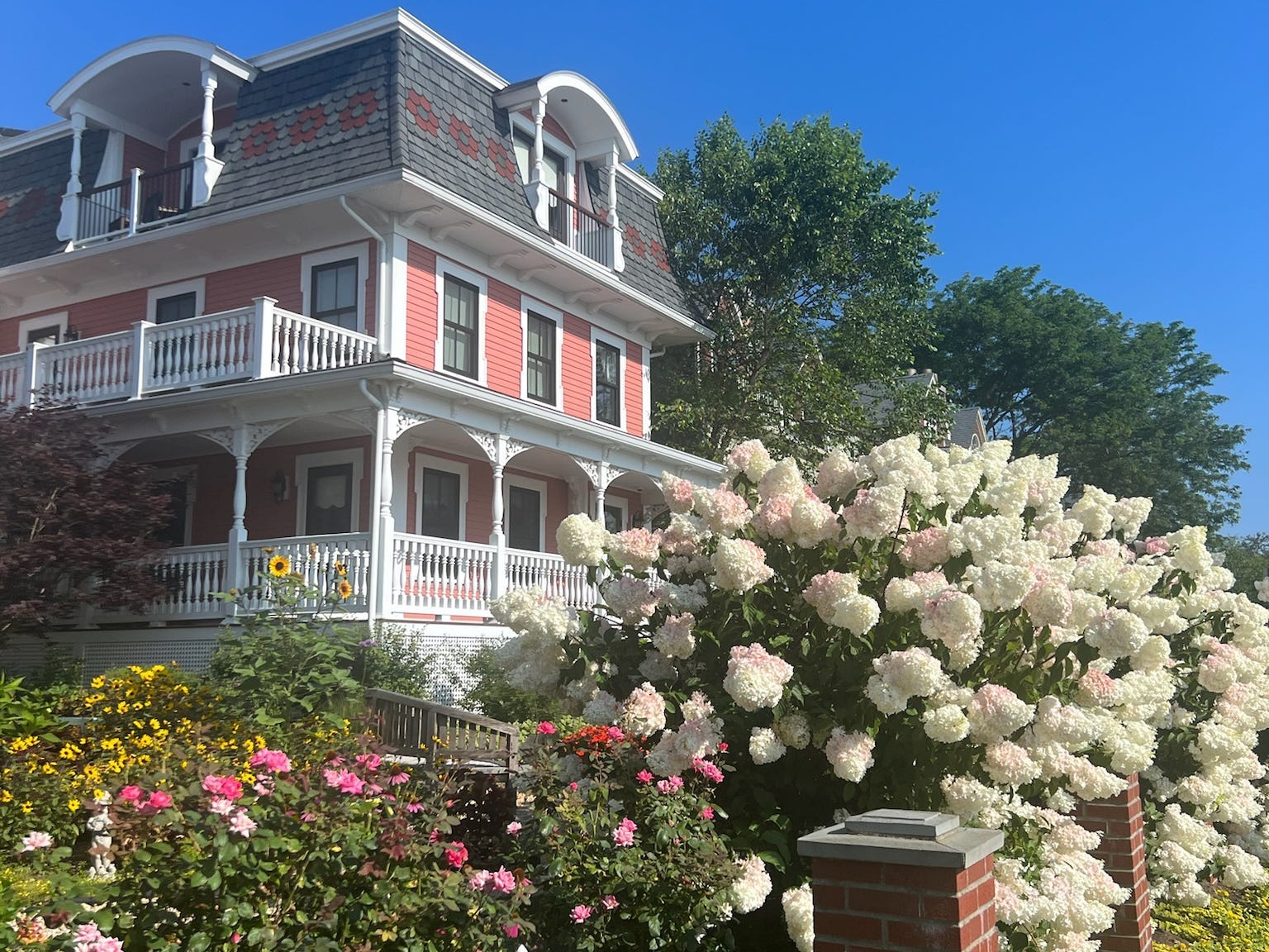 Pink house with flowers in front in Old Saybrook