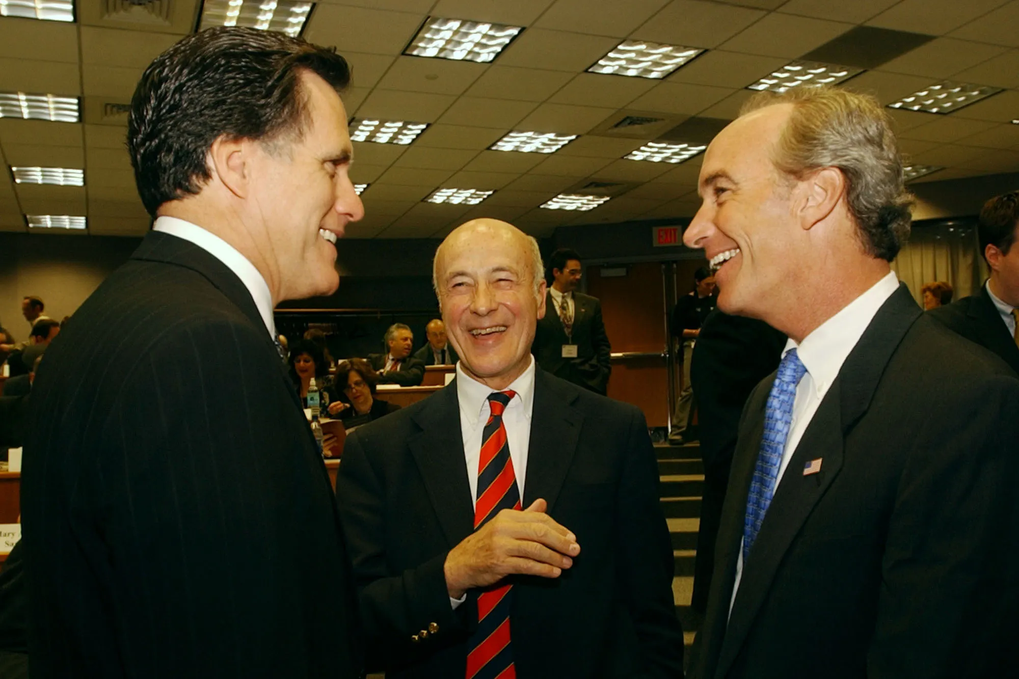 Nye, center, smiles as Romney and Kempthorne look toward each other and smile on either side.