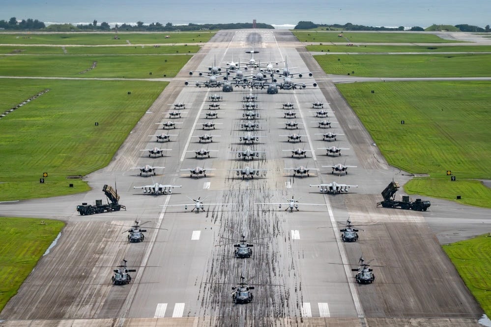 The elephant walk at Kadena Air Base included aircraft and equipment from the US Air Force, Army, and Navy.