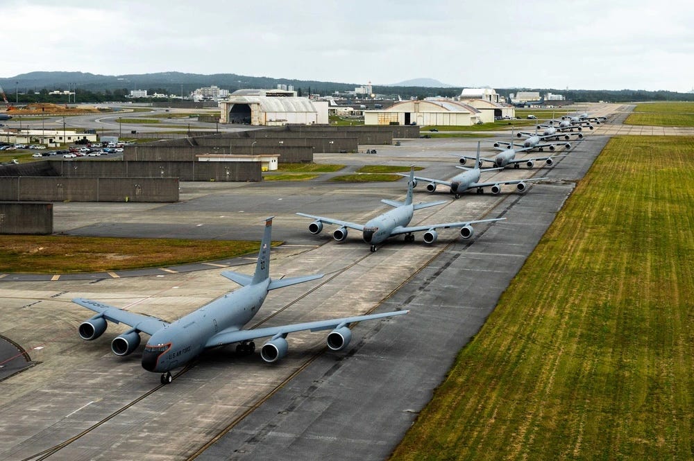 US Air Force KC-135 Stratotankers line up on a flightline during an elephant walk at Kadena Air Base.