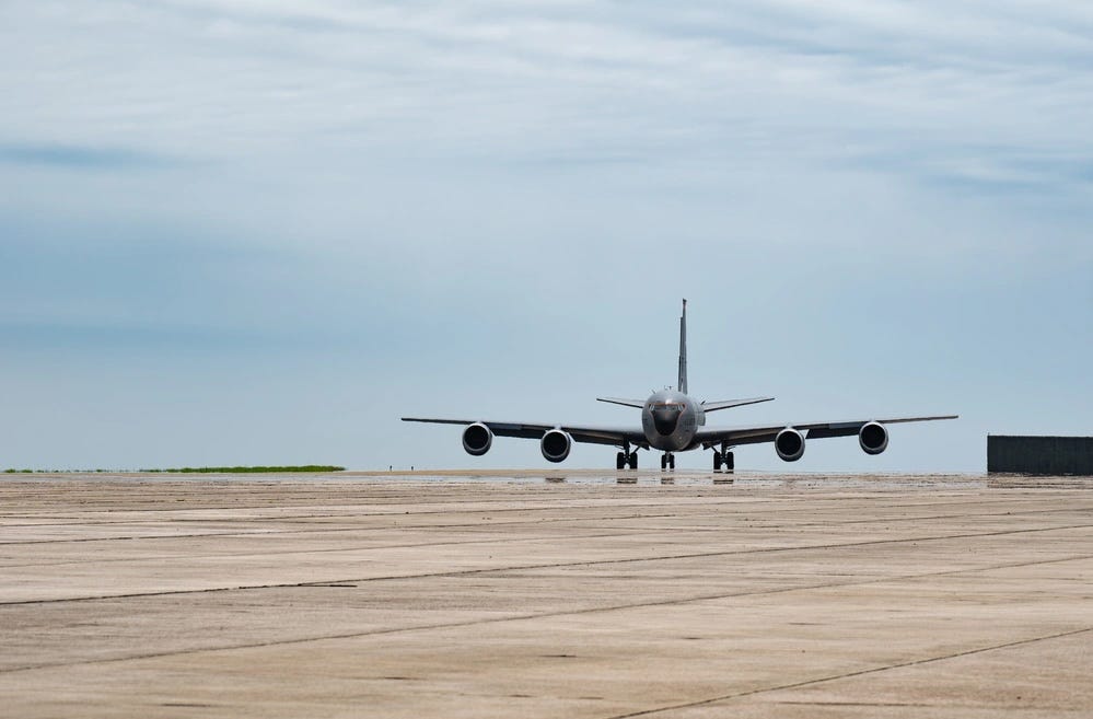 A US Air Force KC-135 Stratotanker taxis down the flightline for an elephant walk at Kadena Air Base.
