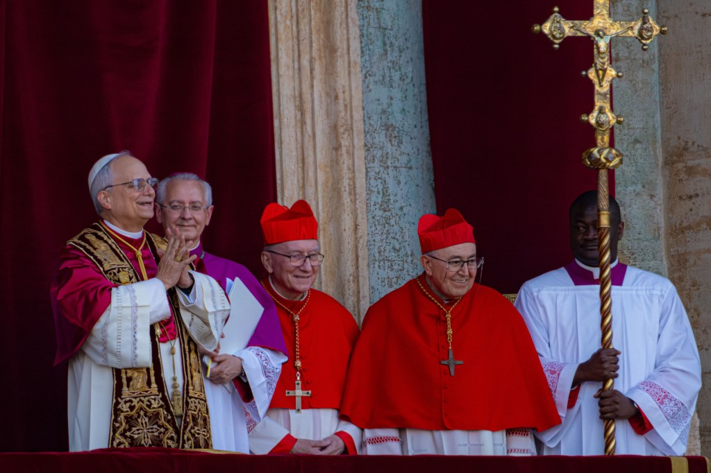 Pope Leo XIV walks out on the loggia of St. Peter's Basilica at the Vatican after being elected pope on May 8, 2025.